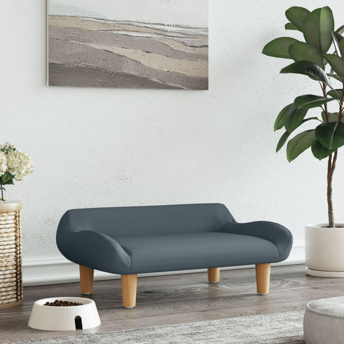 Blaues Haustiersofa mit Holzbeinen. Weiße Schüssel und Pflanze im Hintergrund.