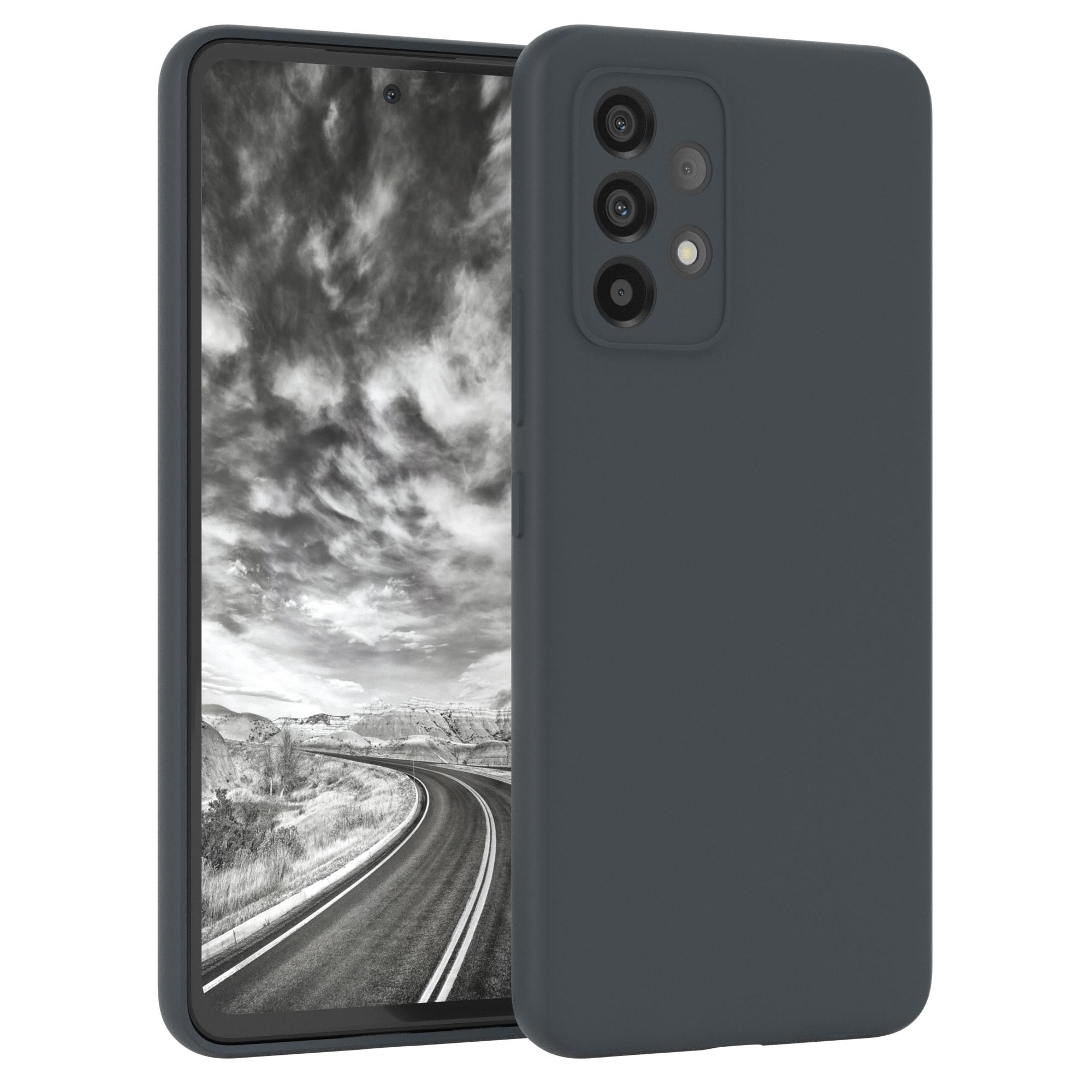 Telefon, graue Hülle, Berge im Hintergrund.