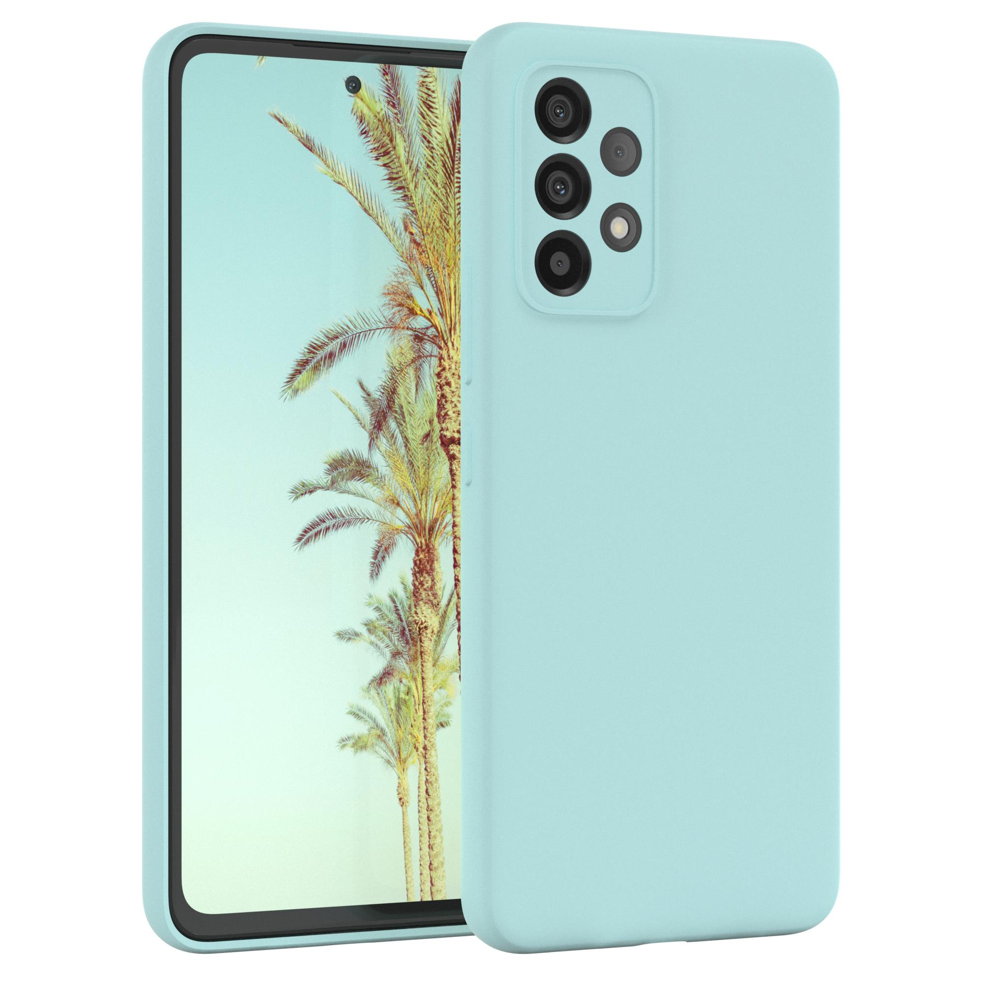 Blaue Handyhülle mit Telefon, das Palmen zeigt. Es hat eine Kamera.
