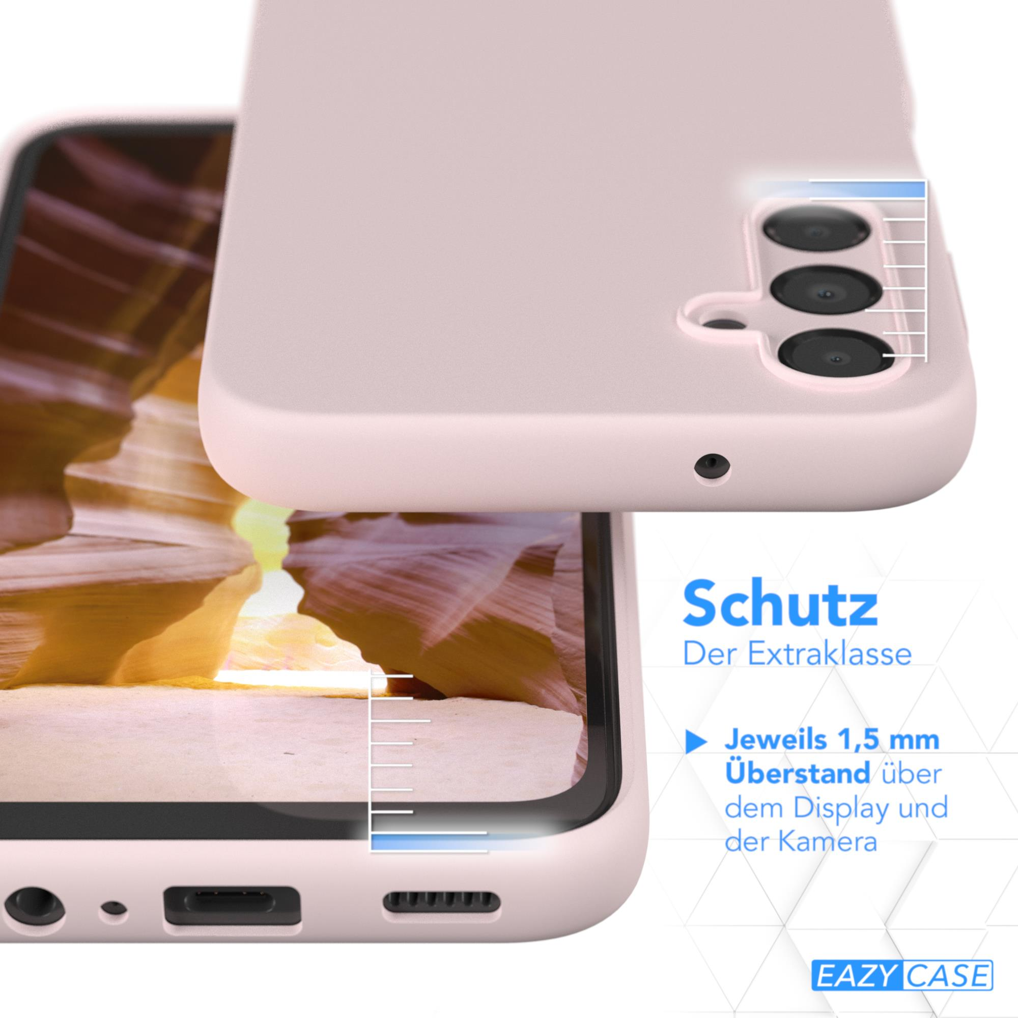 Nahaufnahme einer rosa Handyhülle mit Details, mit einem Telefon und Text auf Deutsch.