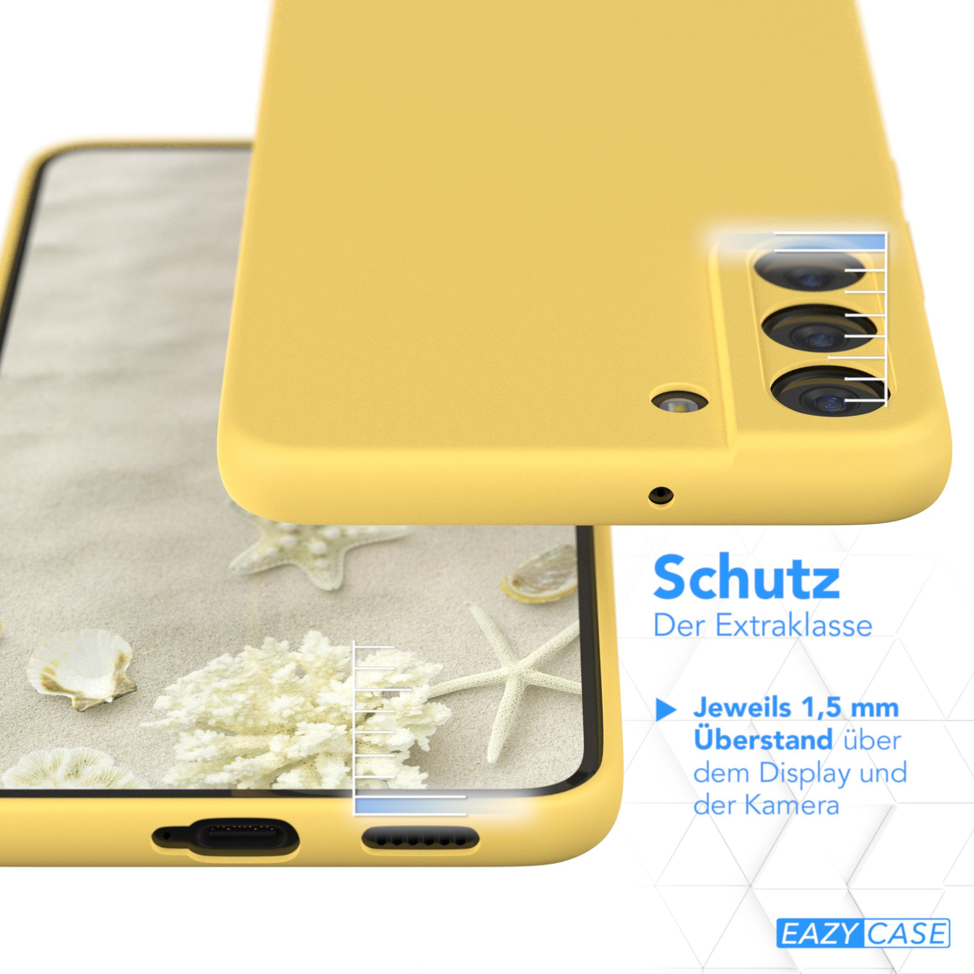 Gelbe Handyhülle mit Telefon darin. Text auf Deutsch rechts, Strandszene im Hintergrund.