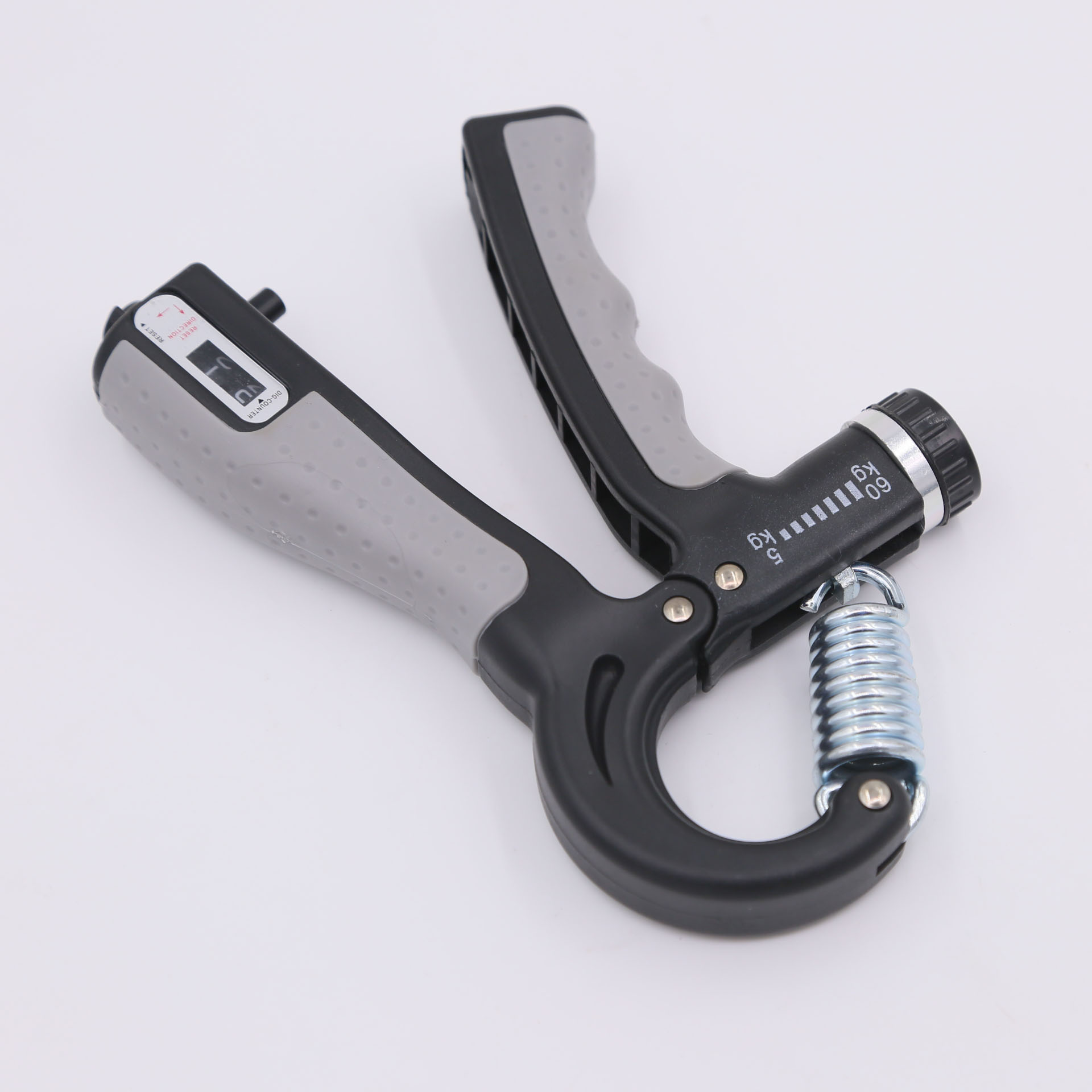 Wzmacniacz uchwytu dłoni. Ma szare uchwyty, czarny uchwyt i sprężynę.