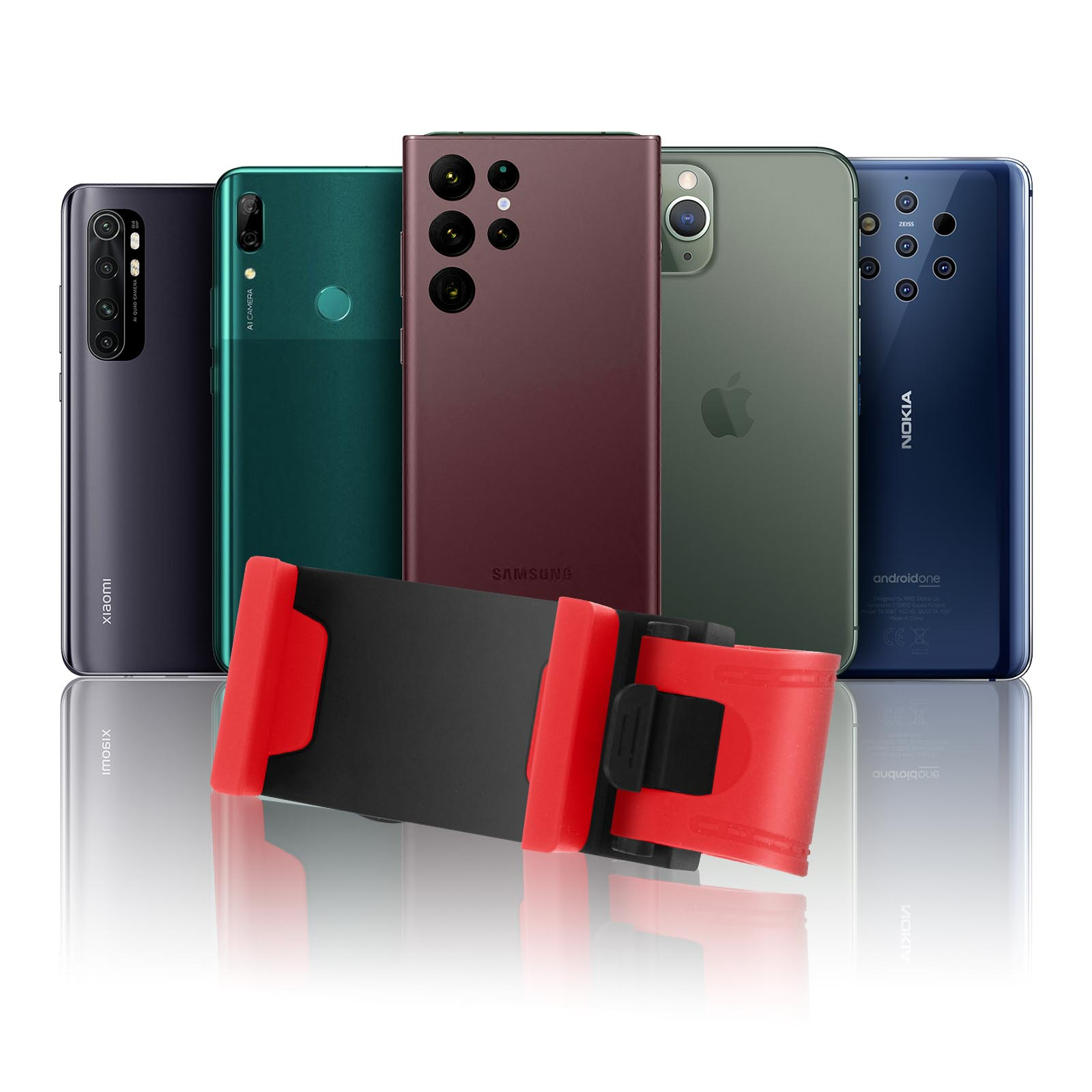 Cinco smartphones, varios colores y marcas, y un soporte rojo para teléfono, sobre superficie blanca.