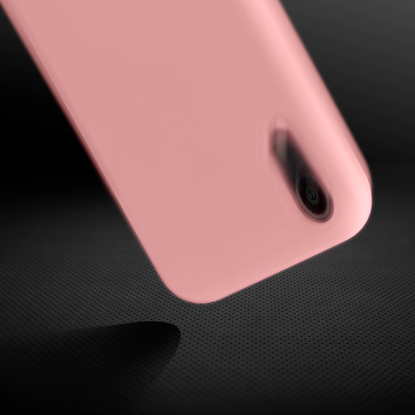 Roze telefoonhoesje, met de uitsparing voor de camera en de textuur.