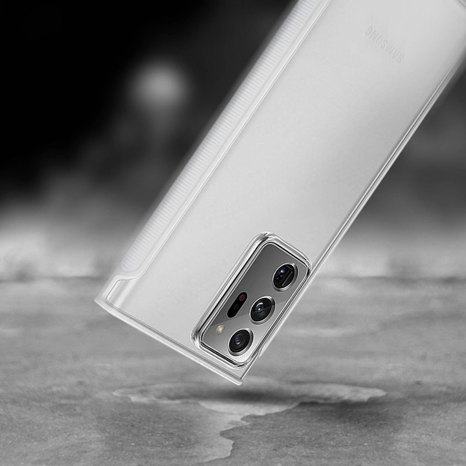 Una custodia trasparente per telefono su una superficie strutturata, che mostra la fotocamera del telefono.