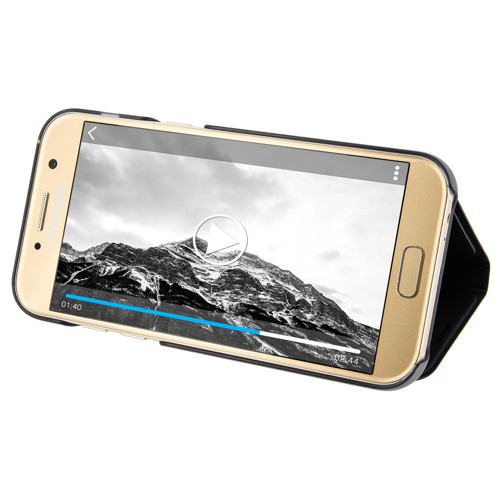 Teléfono dorado en una funda negra, reproduciendo un vídeo con un paisaje montañoso.