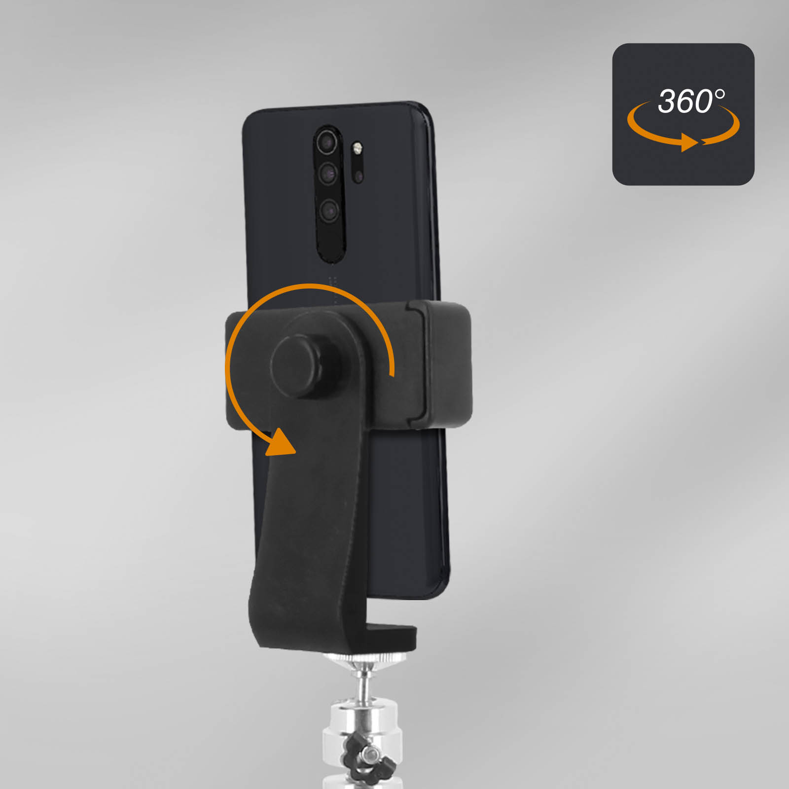 Teléfono negro en un soporte, con flecha que indica rotación de 360°.