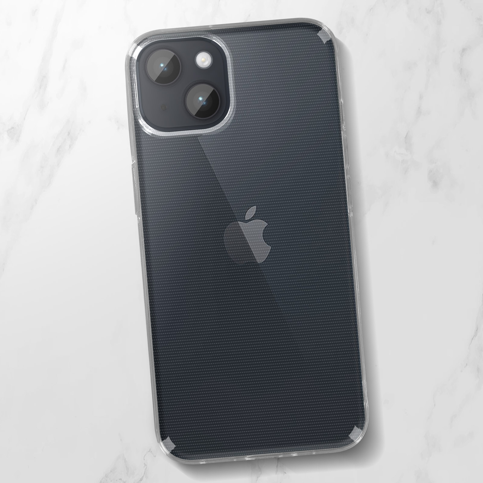 Una custodia trasparente per telefono su una superficie di marmo bianco. Un logo Apple è visibile.