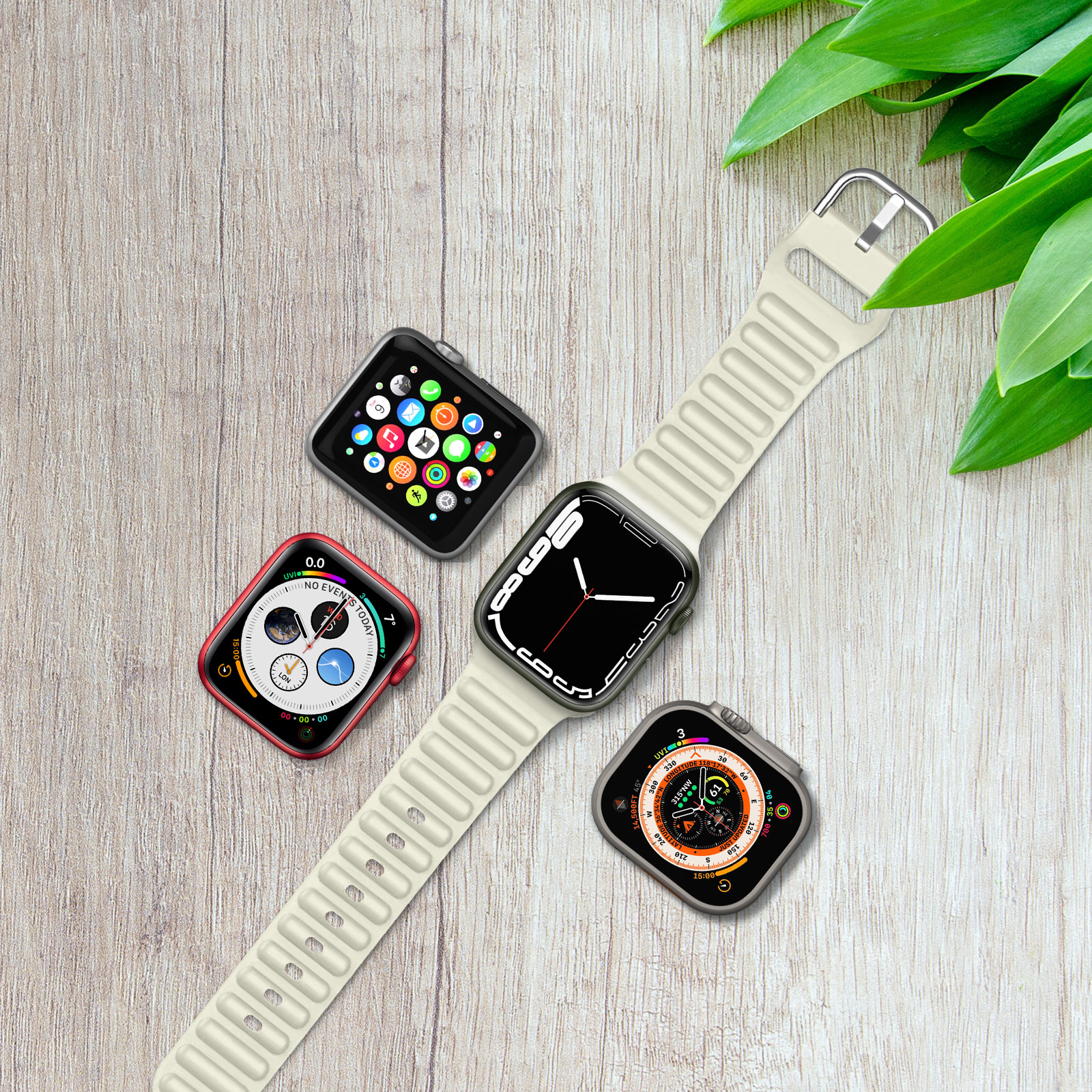 Superficie de madera con 4 smartwatches. Una banda blanca arriba, tres relojes más.