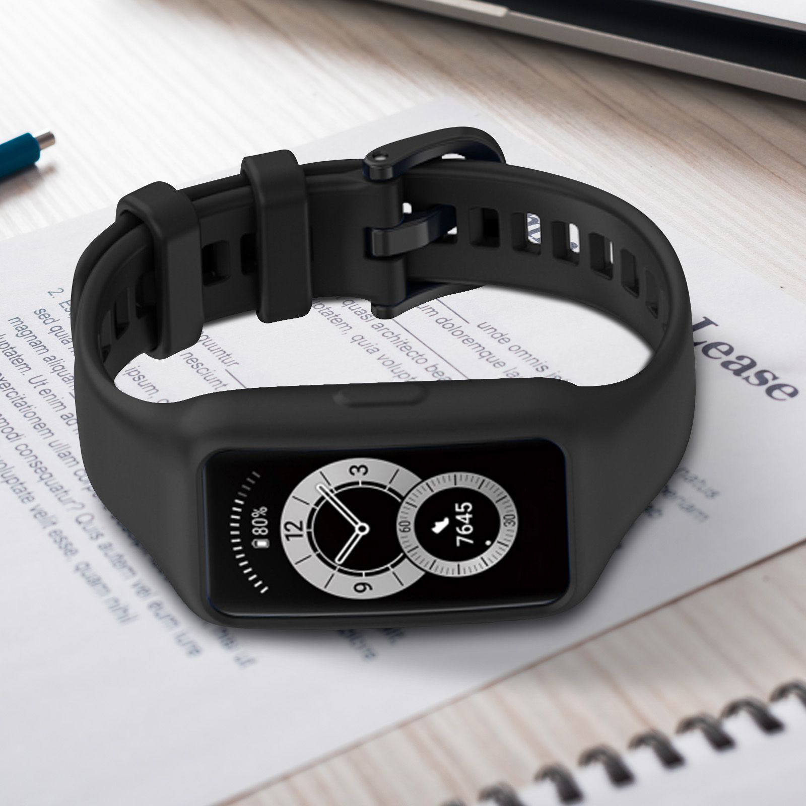 Smartwatch en papel con texto. El reloj es negro con una banda negra.