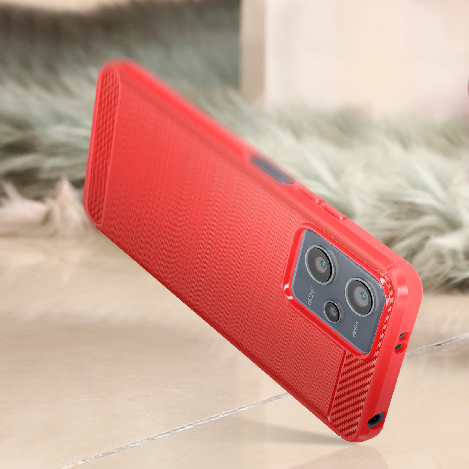Una custodia rossa per telefono con un design strutturato. La fotocamera ha più lenti.