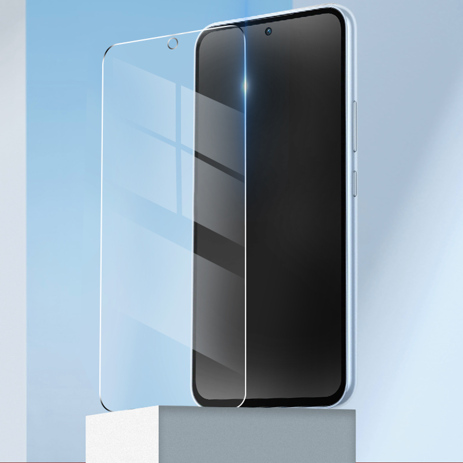 Teléfono con un protector de pantalla. El teléfono está sobre una superficie blanca con fondo azul.