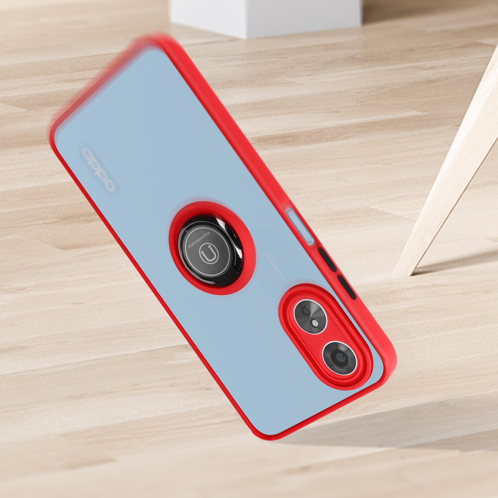 Una custodia per telefono con cornice rossa e retro blu. Il telefono sta cadendo. Sfondo in legno.