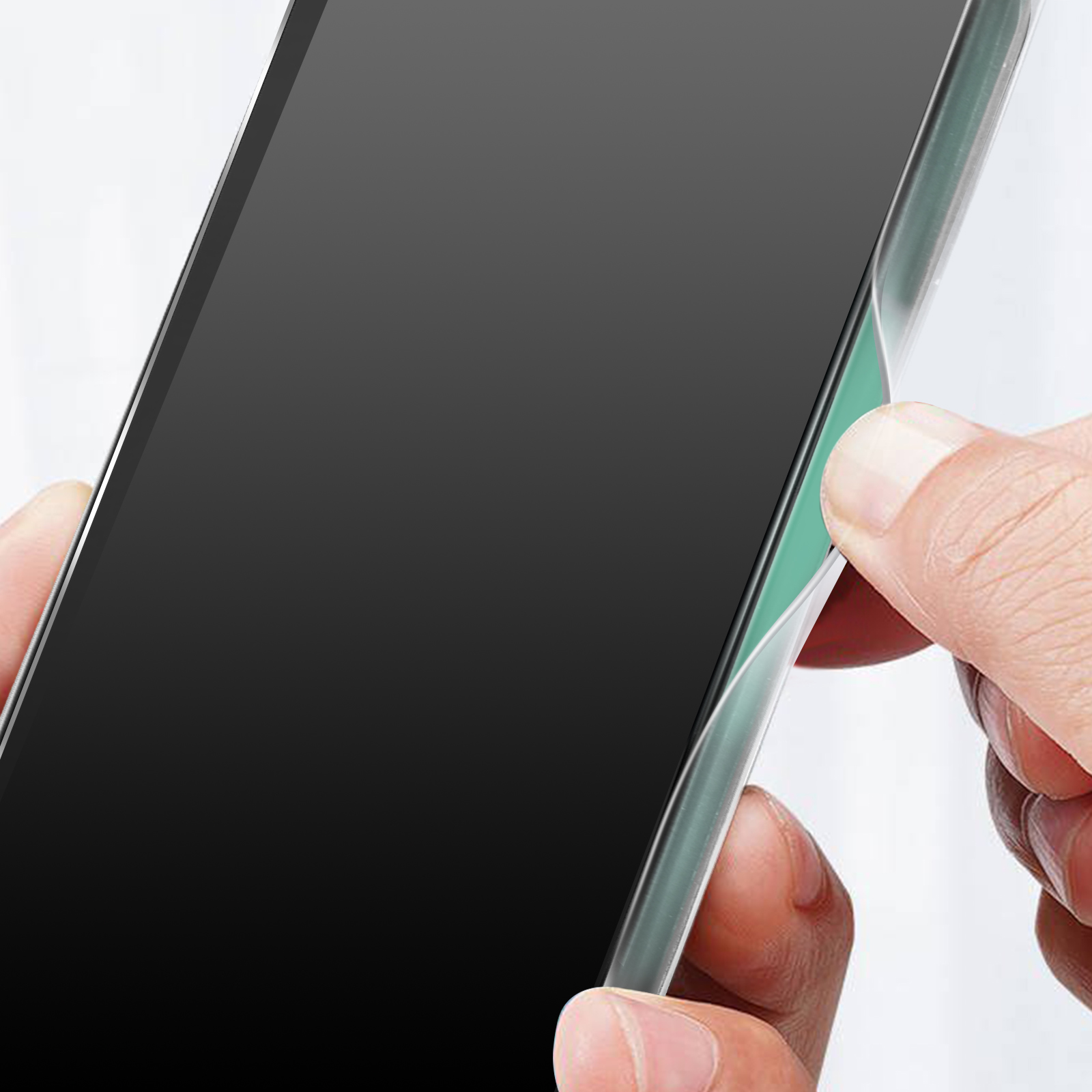 A hand holding a phone, applying a screen protector with a teal border.