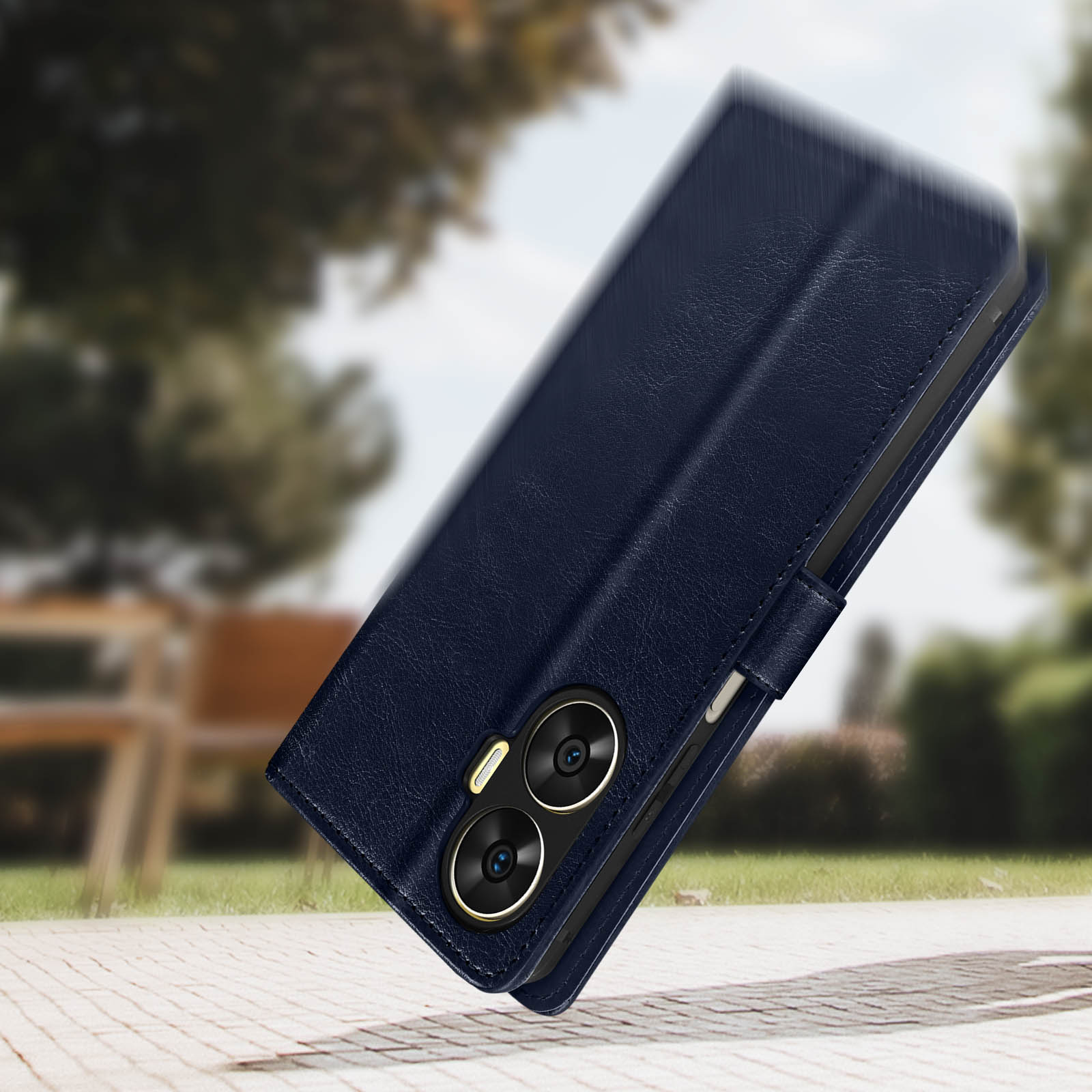 Eine blaue Handyhülle, geöffnet, das Telefon zeigend, auf einer Steinoberfläche.