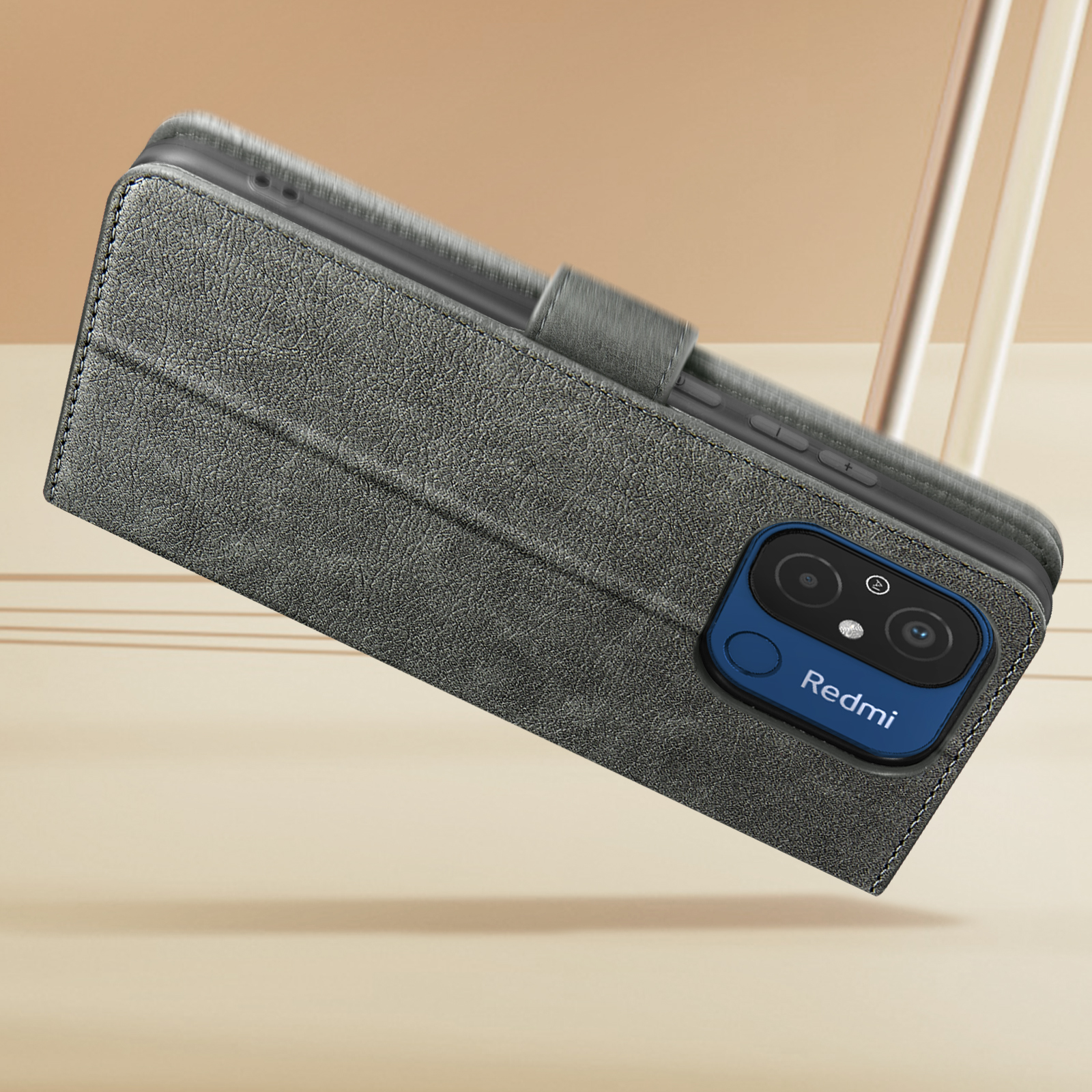 Eine graue Handyhülle mit einem Telefon darin. Die Hülle ist geöffnet und trägt unten das Wort Redmi.