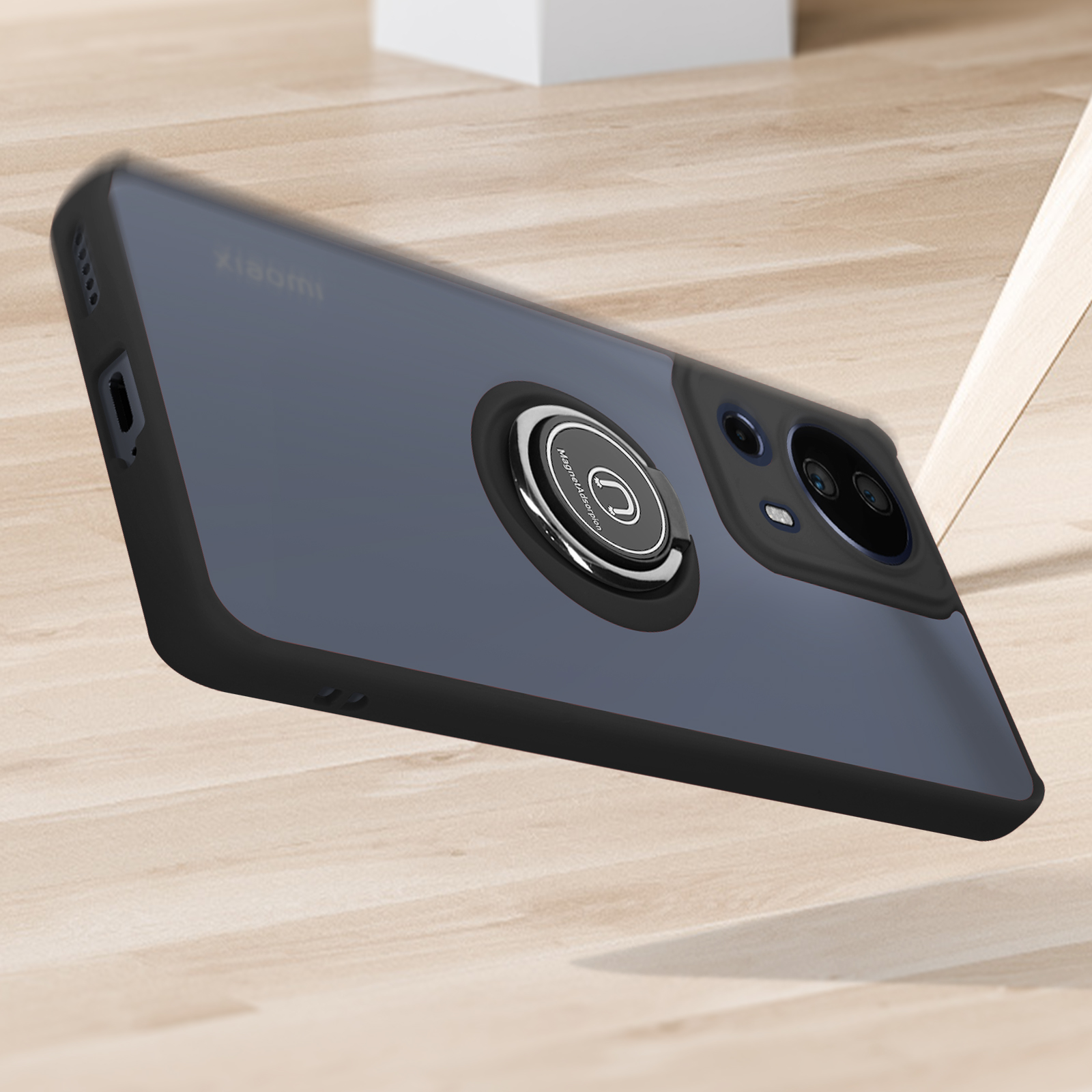Una custodia per telefono nera e blu con un supporto ad anello su una superficie di legno.