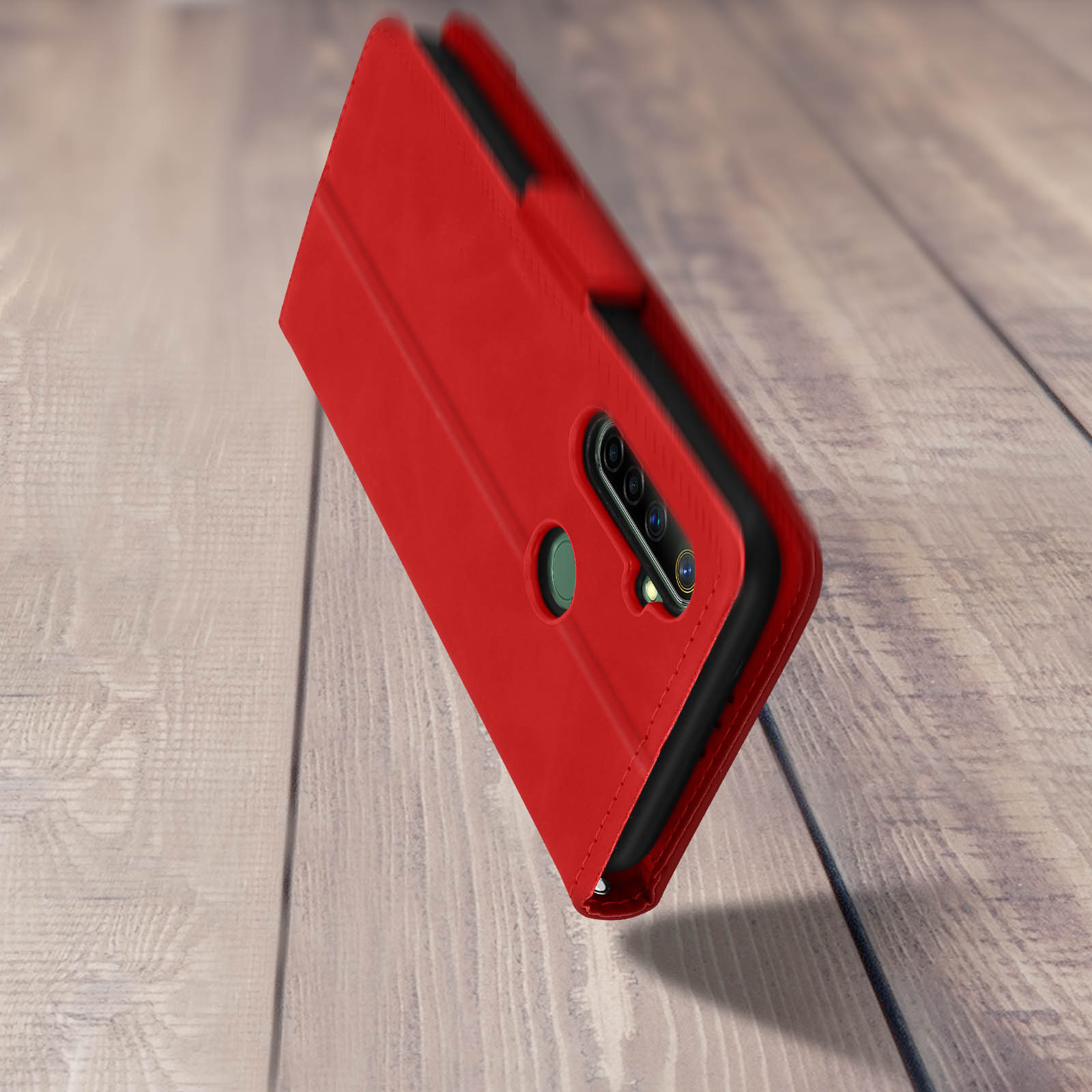 Custodia per telefono rossa con un telefono all'interno, esposta su una superficie in legno.