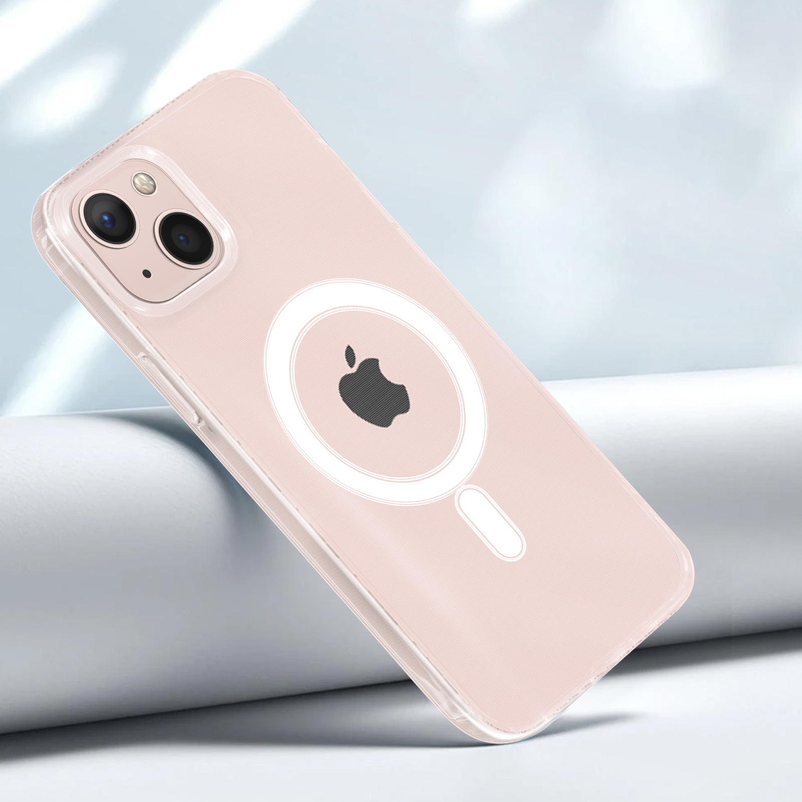 Una custodia rosa con anello MagSafe e logo Apple, su sfondo chiaro.