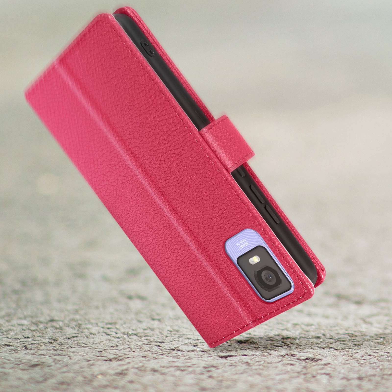 Custodia rosa per telefono, aperta, con il telefono parzialmente visibile, su una superficie strutturata.