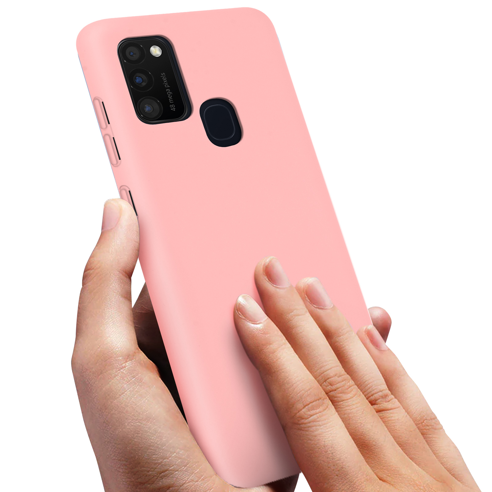 Mano che tiene una custodia rosa con intaglio quadrato per fotocamera e più obiettivi.