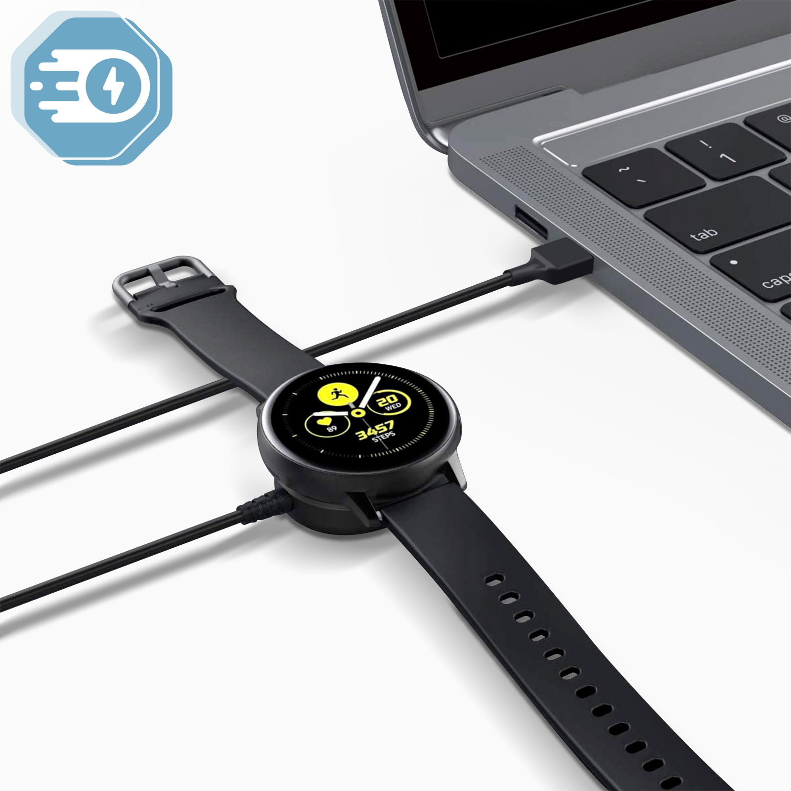 Smartwatch in carica su un laptop, collegato tramite cavo USB.