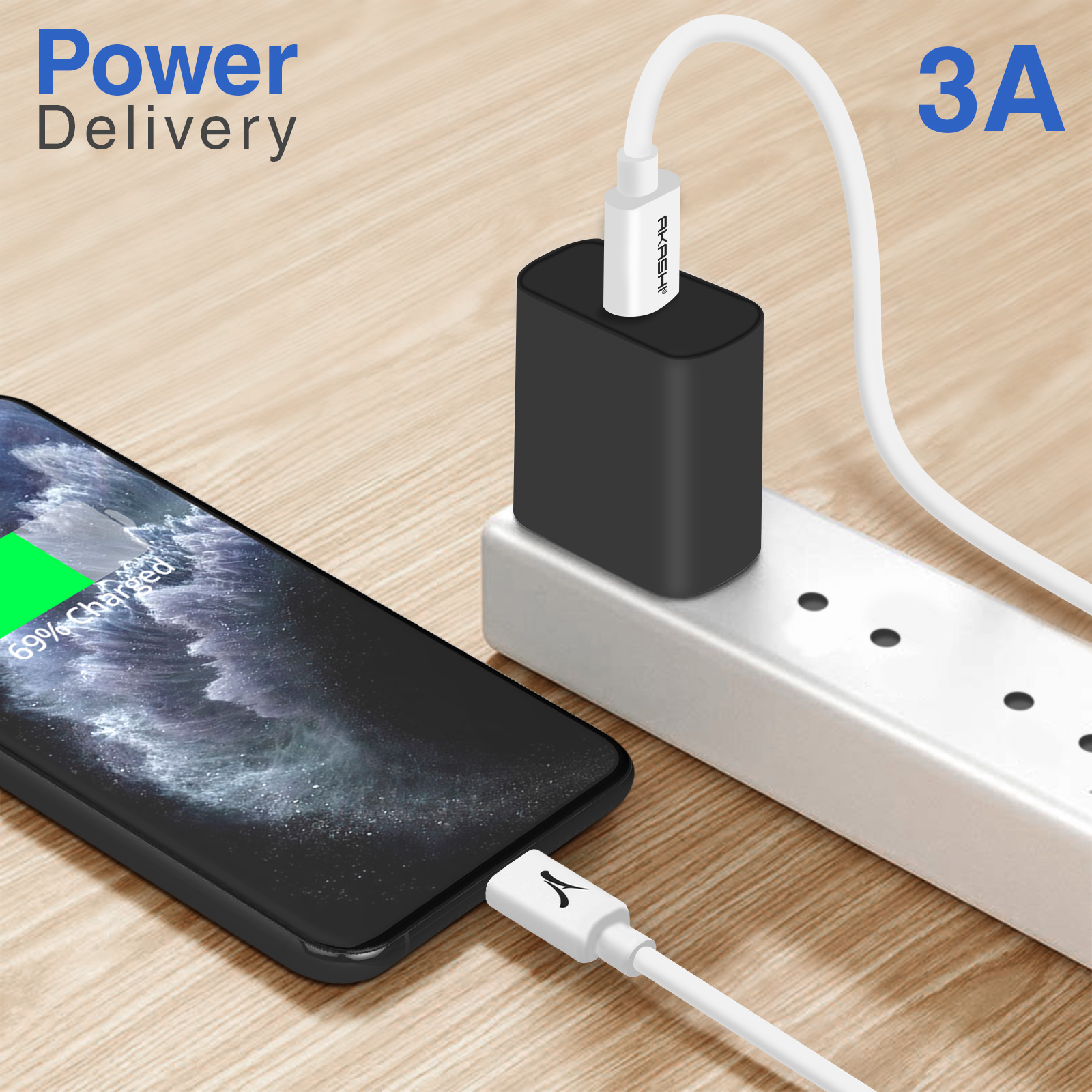Un teléfono cargando en una mesa de madera con un cargador negro. El texto dice suministro de energía y 3A.