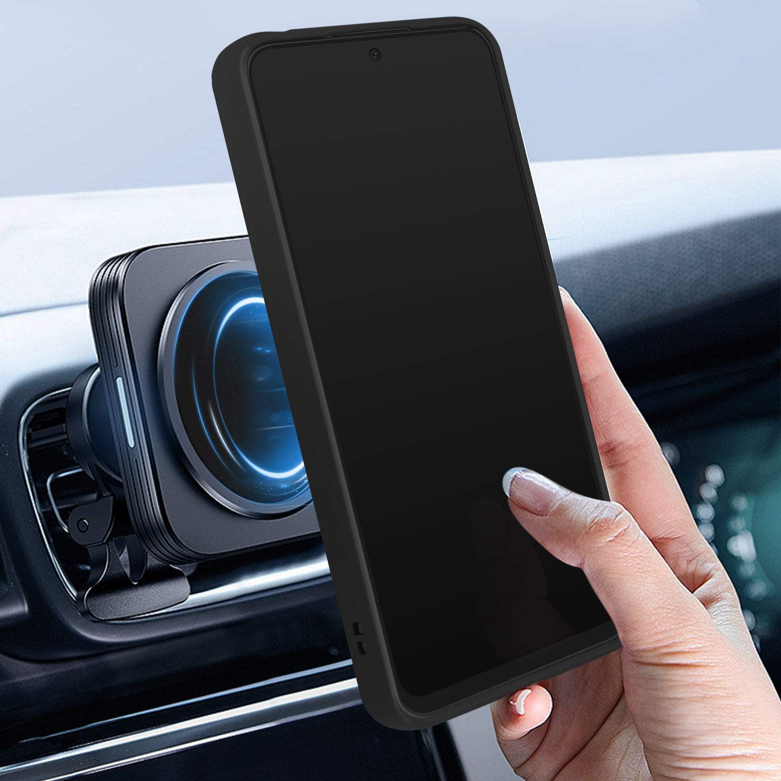 Mano che tiene un telefono nero in auto. Il telefono è vicino a un supporto magnetico.