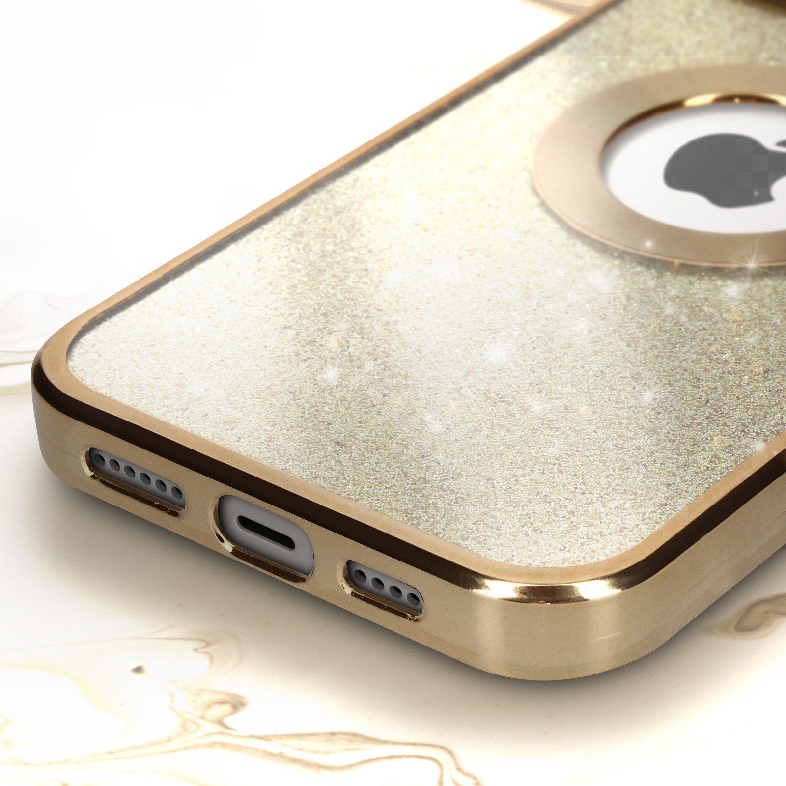 Primo piano della parte inferiore di una custodia dorata per iPhone. Sono visibili le porte e il logo Apple.