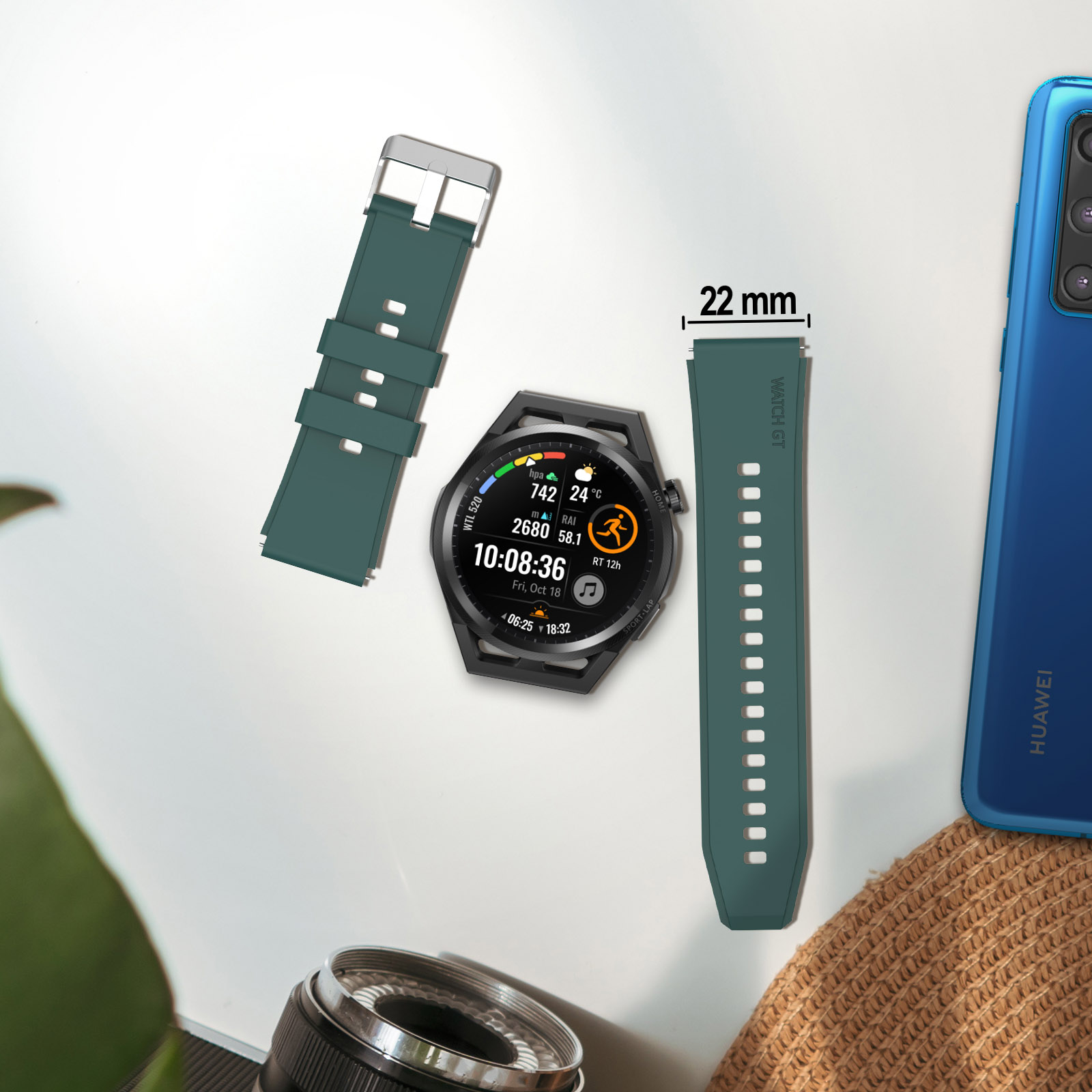 Reloj y correas de reloj, correas verdes de 22 mm. Un teléfono y una cámara en el fondo.
