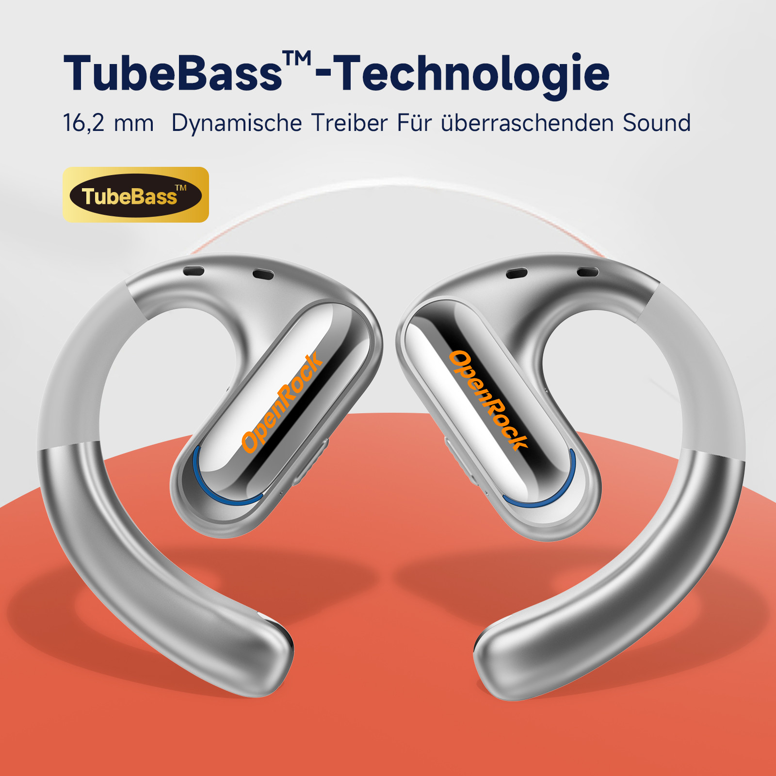 Due cuffie argentate a orecchio aperto con le parole TubeBass e OpenRock su uno sfondo bianco.