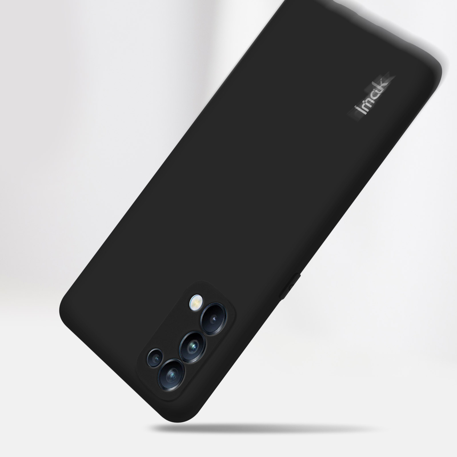 Custodia nera per telefono con il marchio Imak nell'angolo in alto a destra. Il telefono ha gli obiettivi della fotocamera.