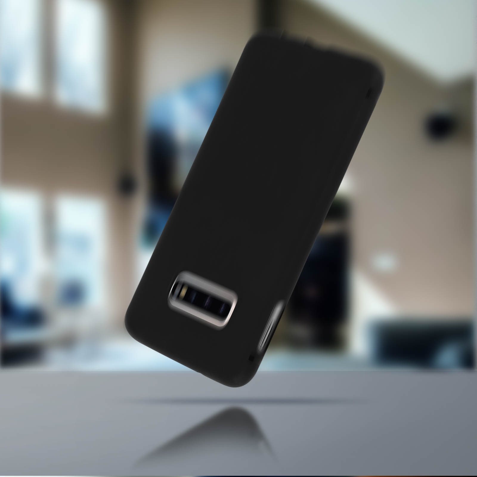 Custodia nera per telefono che fluttua su un tavolo. Sfondo sfocato con una stanza.