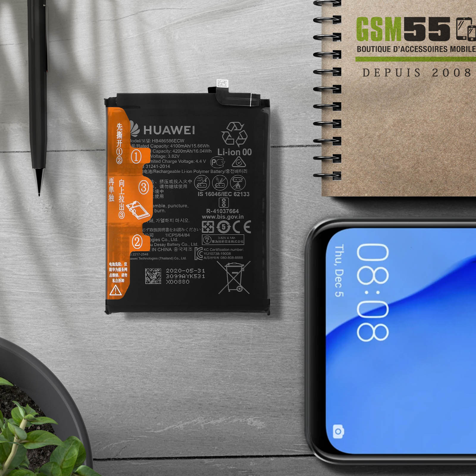 Une batterie de téléphone avec des accents orange, texte noir et fond noir.