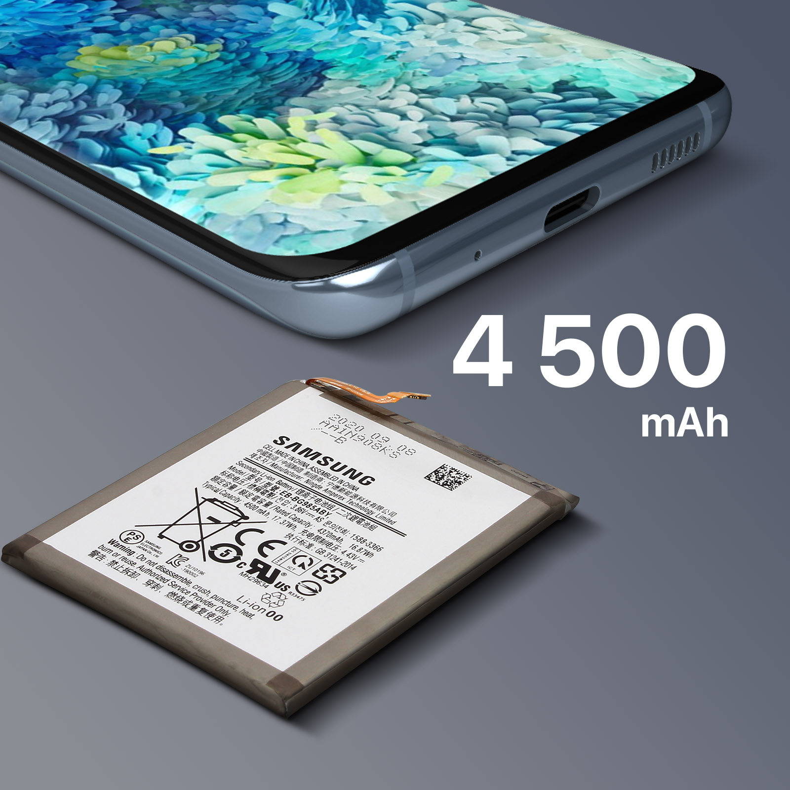 Ein Telefon und ein Akku liegen auf einer grauen Oberfläche. Der Akku hat ein Etikett mit Text und Symbolen.