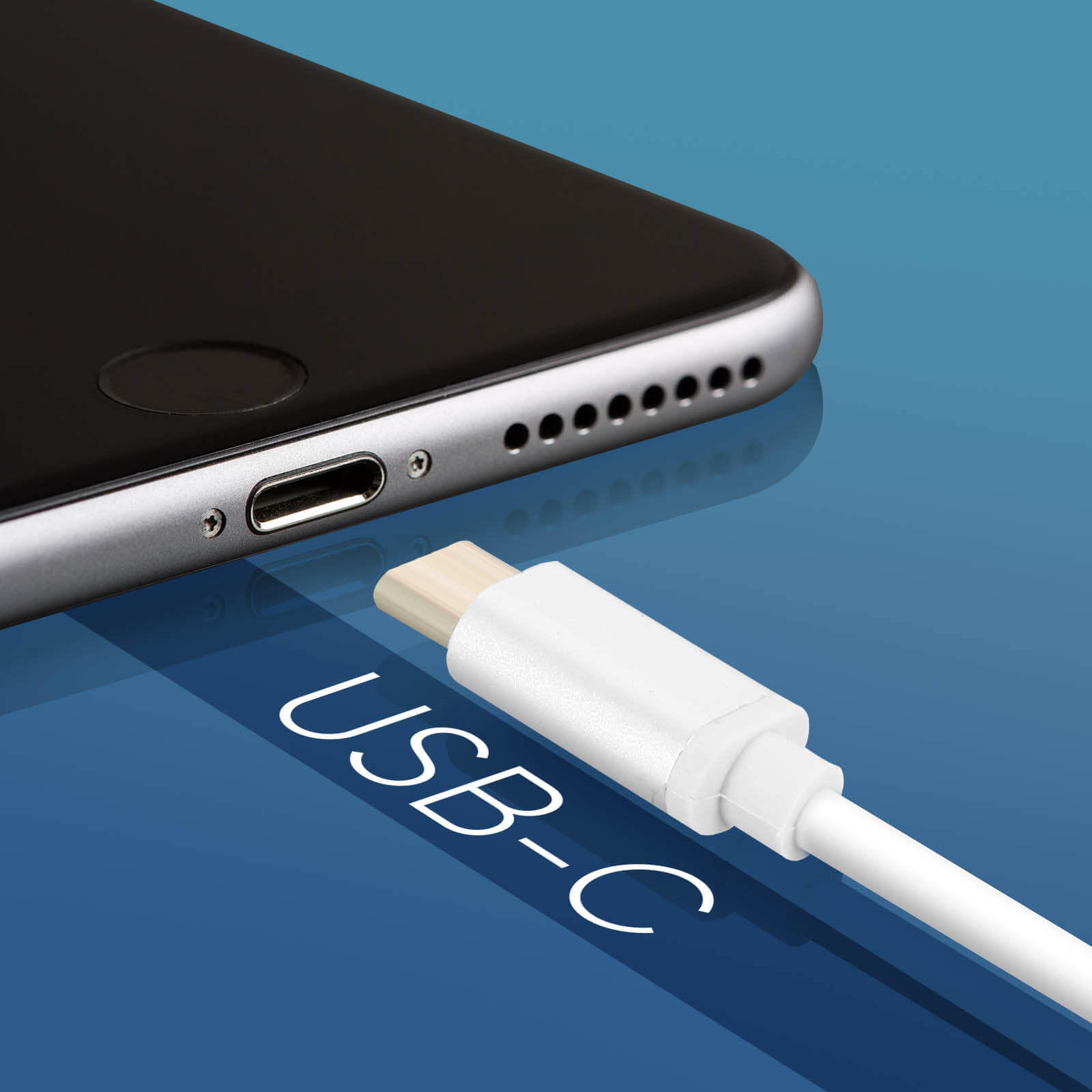Un cable USB-C conectado a la parte inferior de un teléfono negro, sobre una superficie azul.