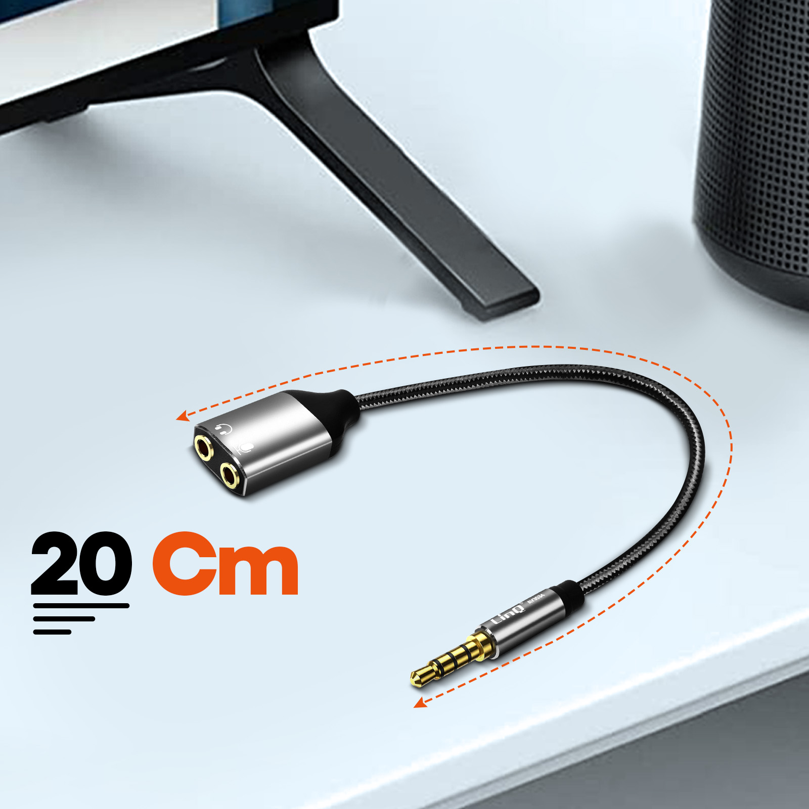 Adaptador de audio con dos jacks y un enchufe jack. El texto '20 cm' es visible.