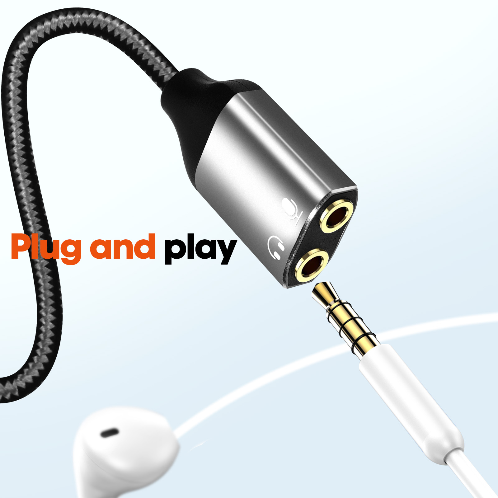 Ein silberner und schwarzer Audio-Splitter mit Kopfhörern und dem Text "Plug and play".