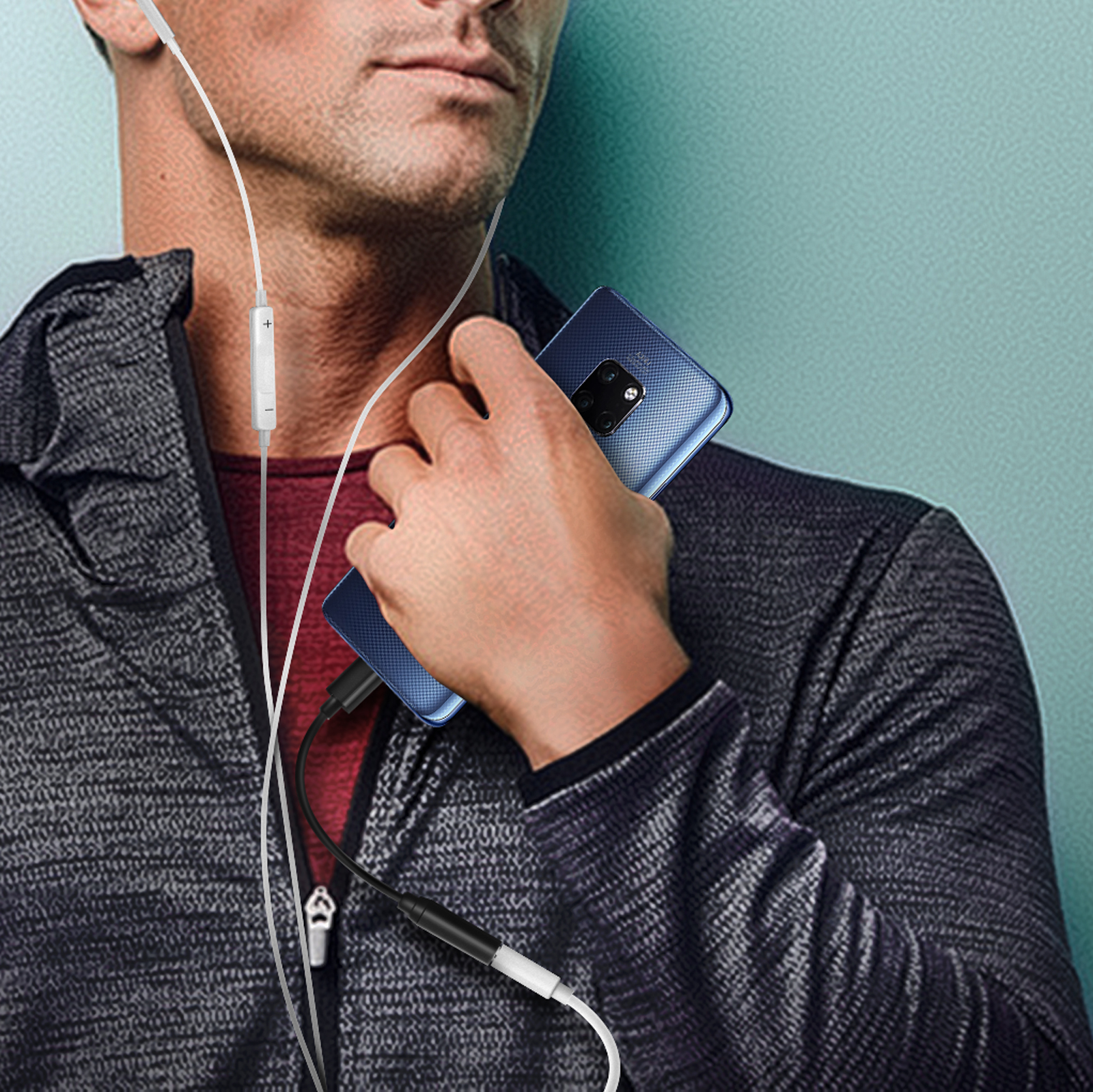 Persona usando auriculares conectados a un teléfono azul.