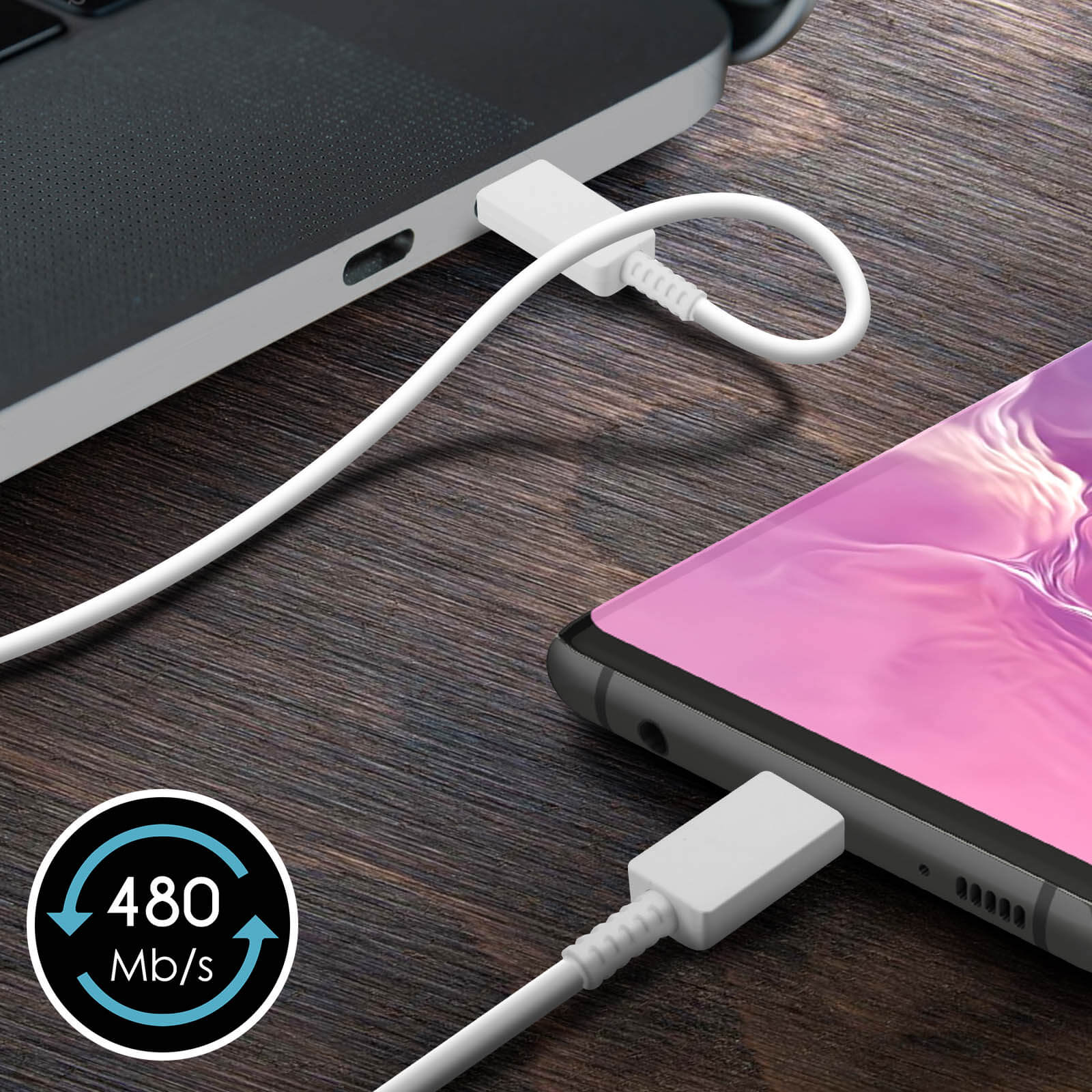 Phone charging from a laptop with a white cable.