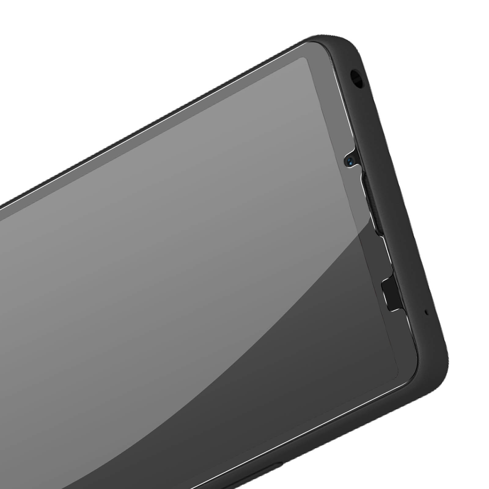 Close-up van een zwart smartphonescherm, met een camera en een rand.