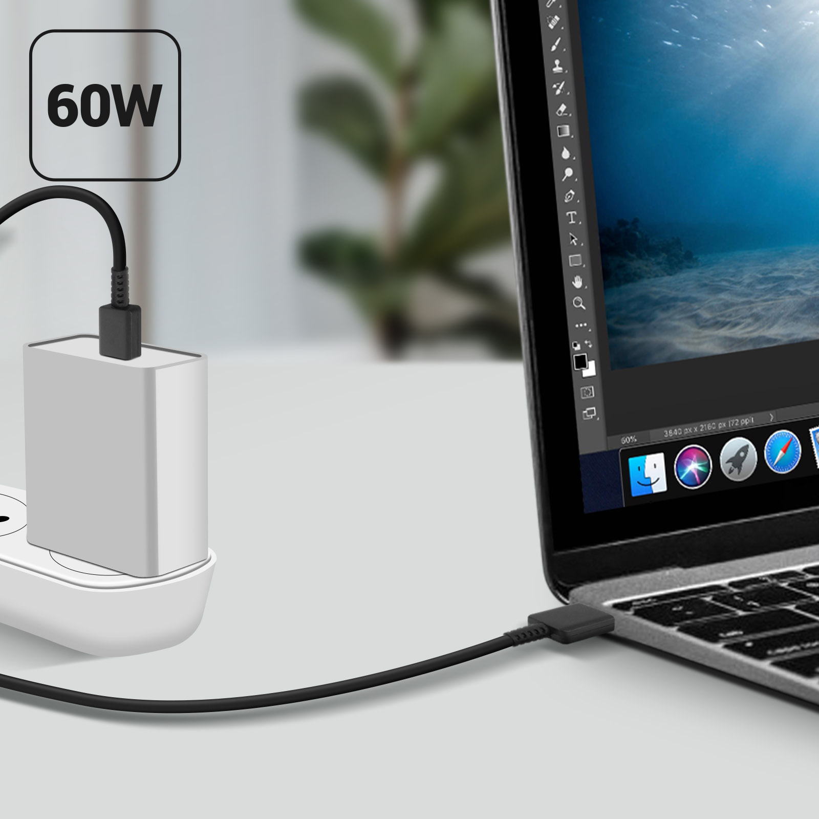 Un caricabatterie bianco è collegato a una parete e collegato a un laptop.