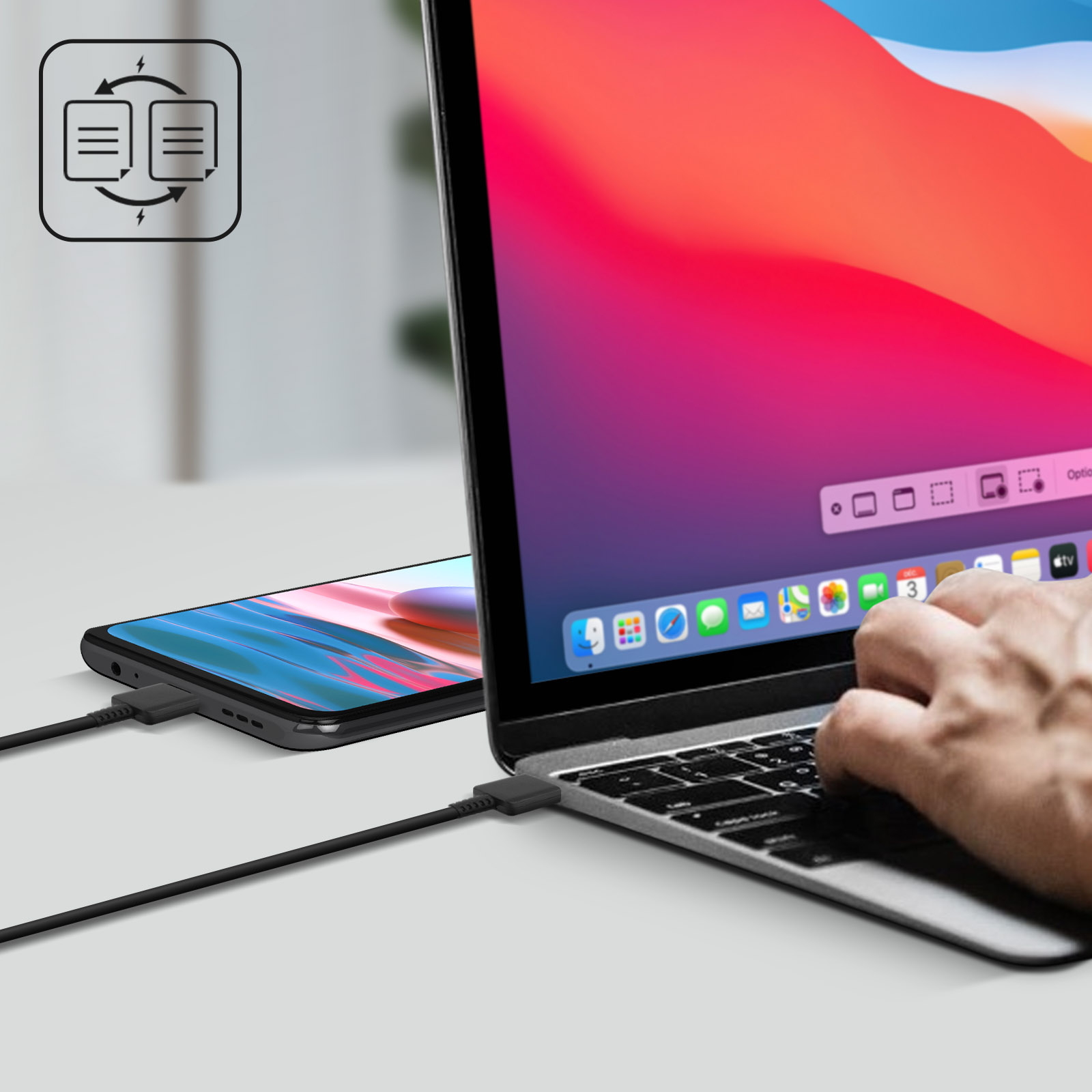 Telefono e laptop collegati tramite cavo. Icone trasferimento dati e mano che interagisce con laptop.