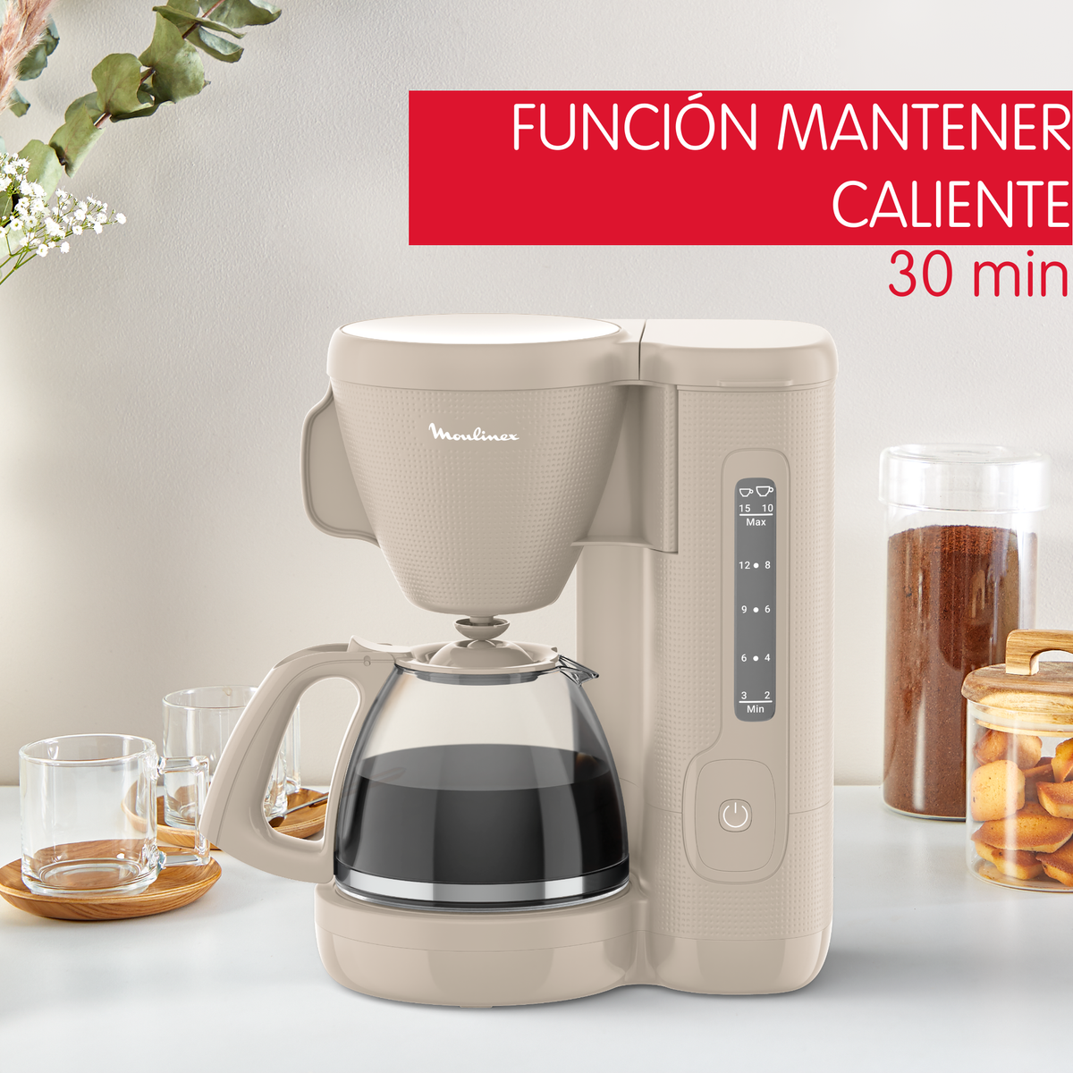 Caffettiera beige con caraffa in vetro. Un testo recita 'Función Mantener Caliente 30 min'.