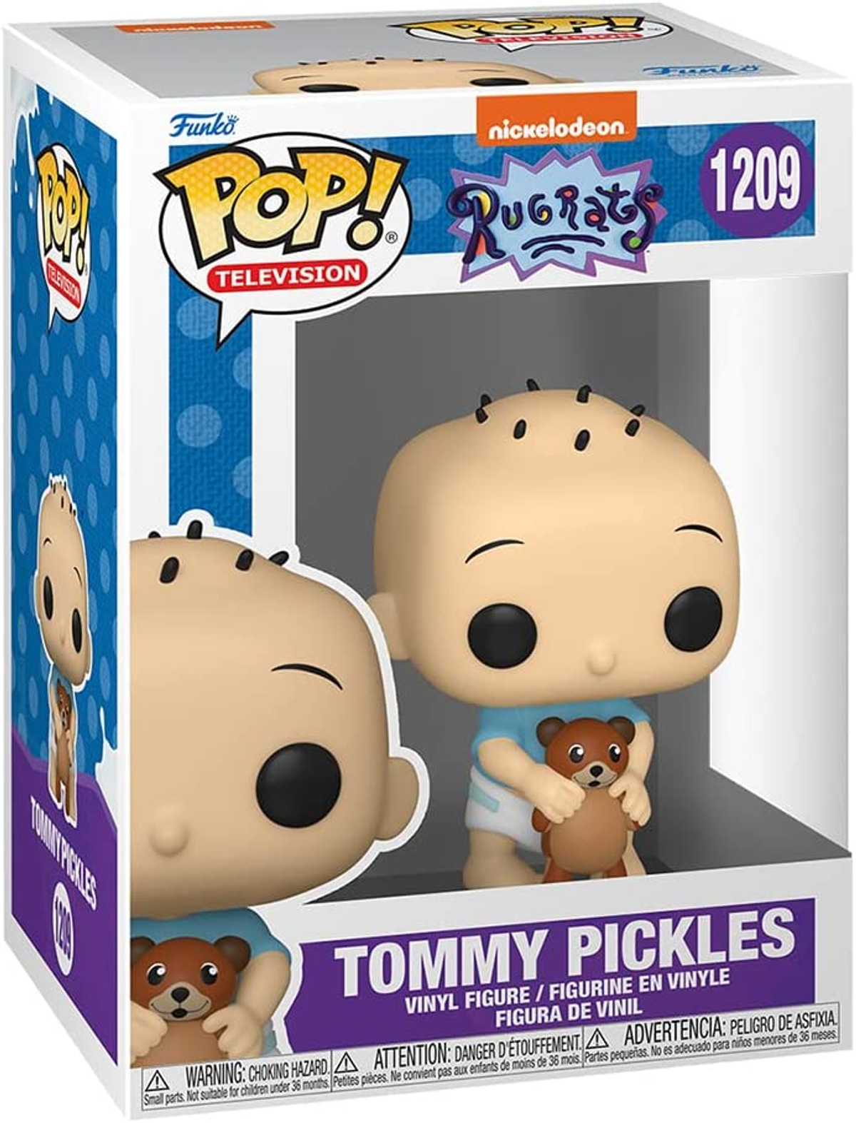 Funko Pop Figur von Tommy Pickles aus Rugrats. Er hält einen Teddybär in einer Box.