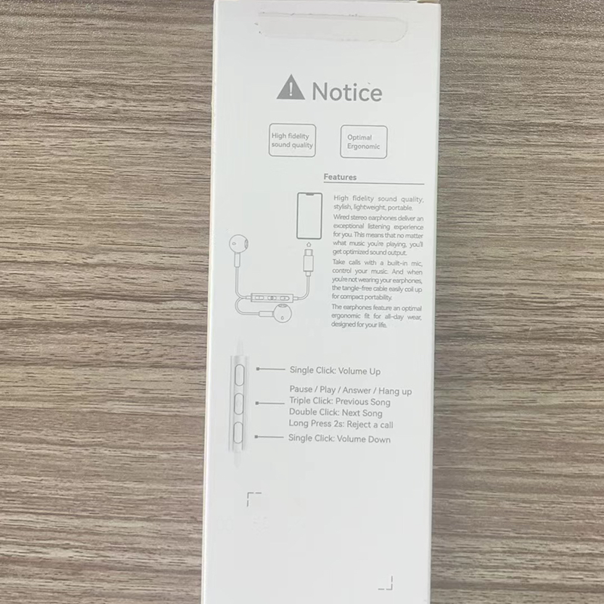 Eine weiße Box mit Text und einer Abbildung von Ohrhörern.