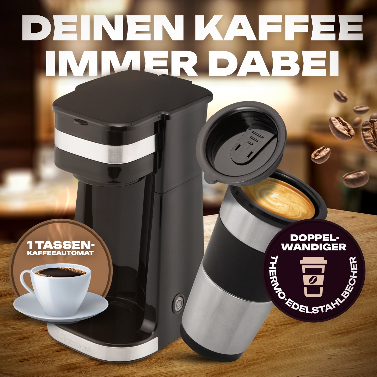 Czarny ekspres do kawy i kubek podróżny z ziarnami kawy. Tekst: Twoja kawa zawsze z Tobą.