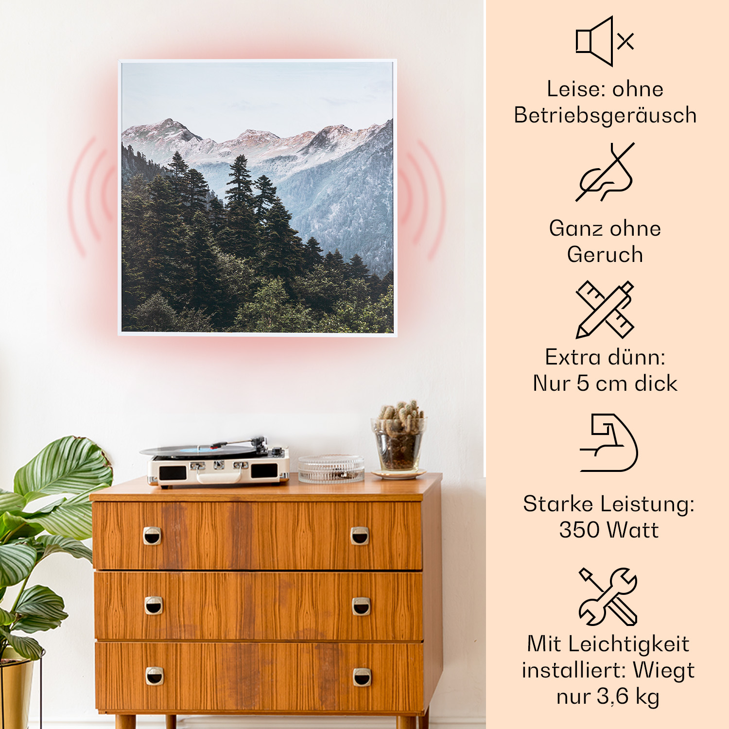 Ein gerahmtes Bild an einer Wand befindet sich neben einer Kommode mit einem Plattenspieler.
