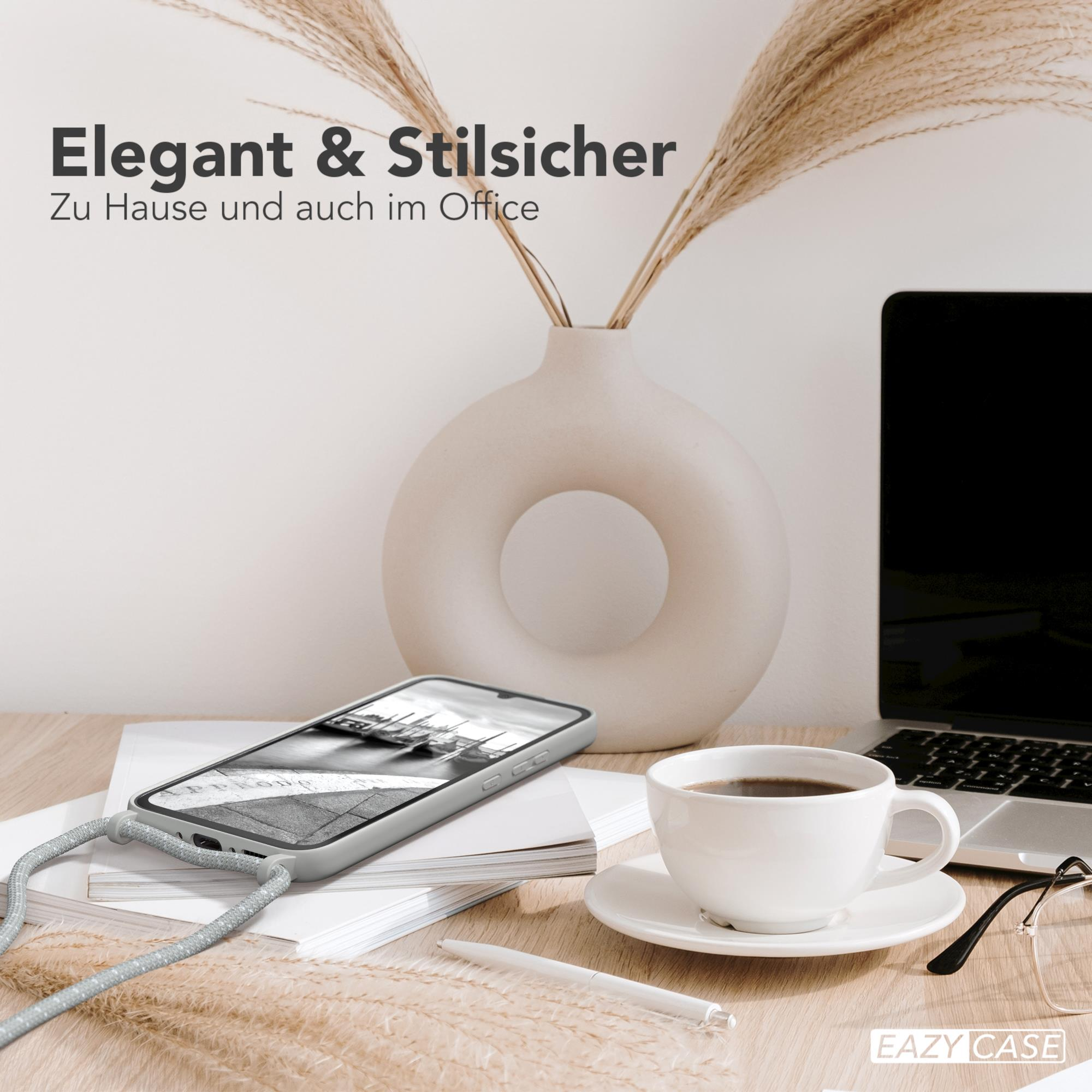 Telefon und Vase auf einem Schreibtisch mit Text 'Elegant & Stilvoll'.