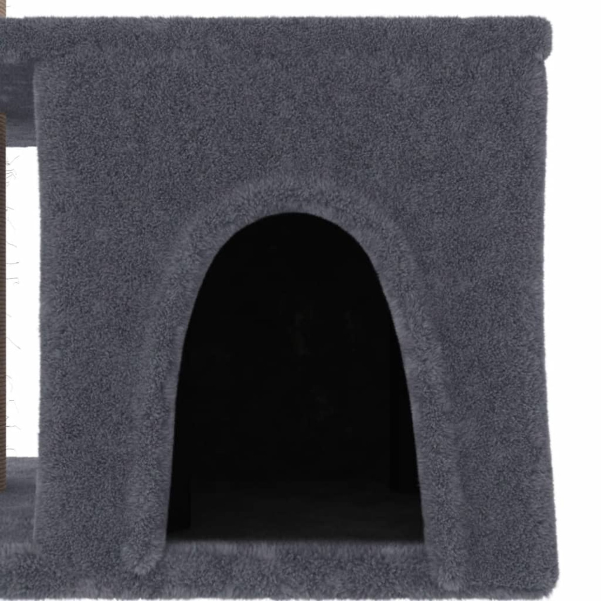 Graues Katzenhaus mit dunklem Eingang und strukturierter Oberfläche.